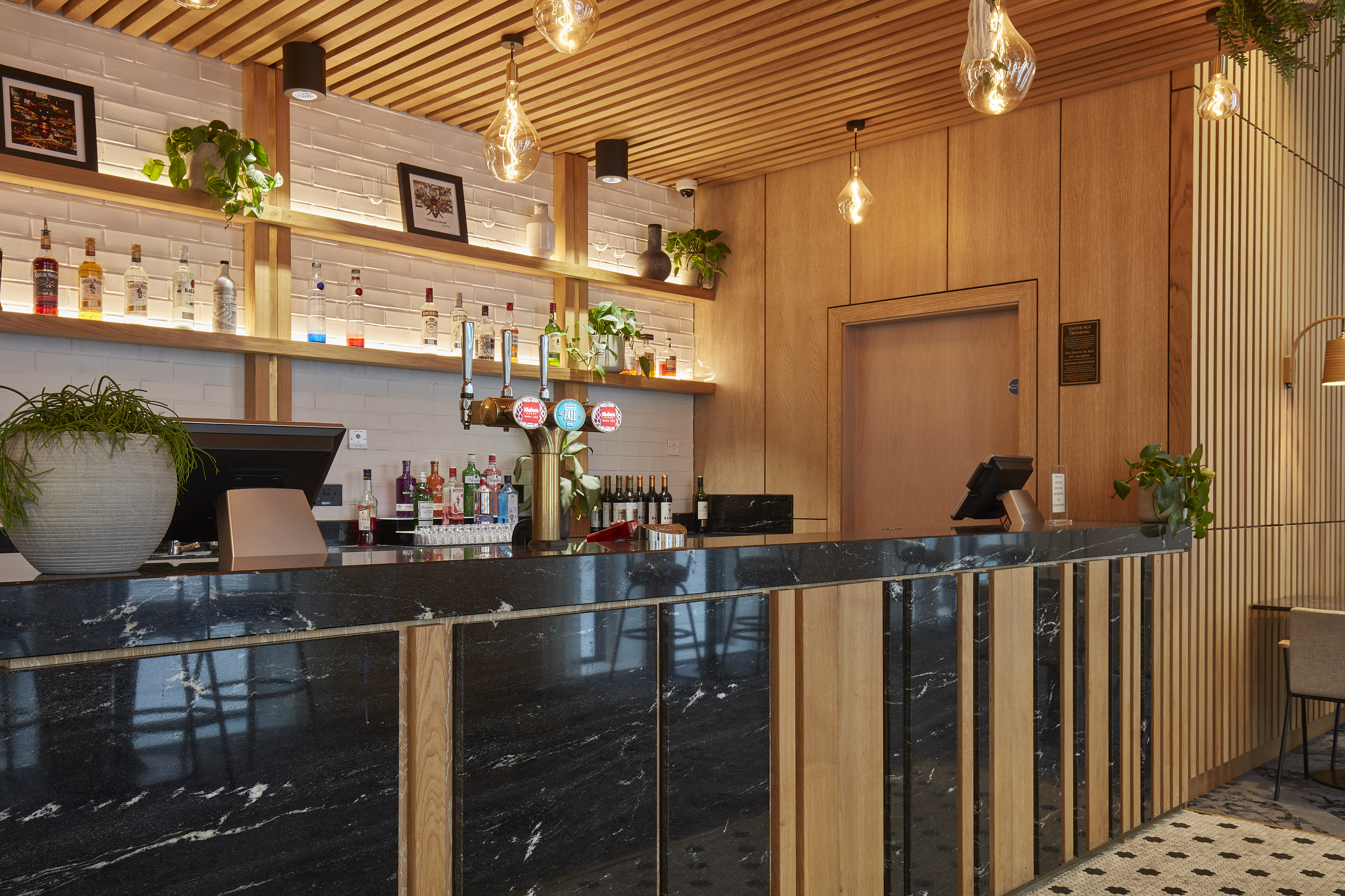 Stylish Salvation Bar with marble counter, ideal for networking events in Manchester.