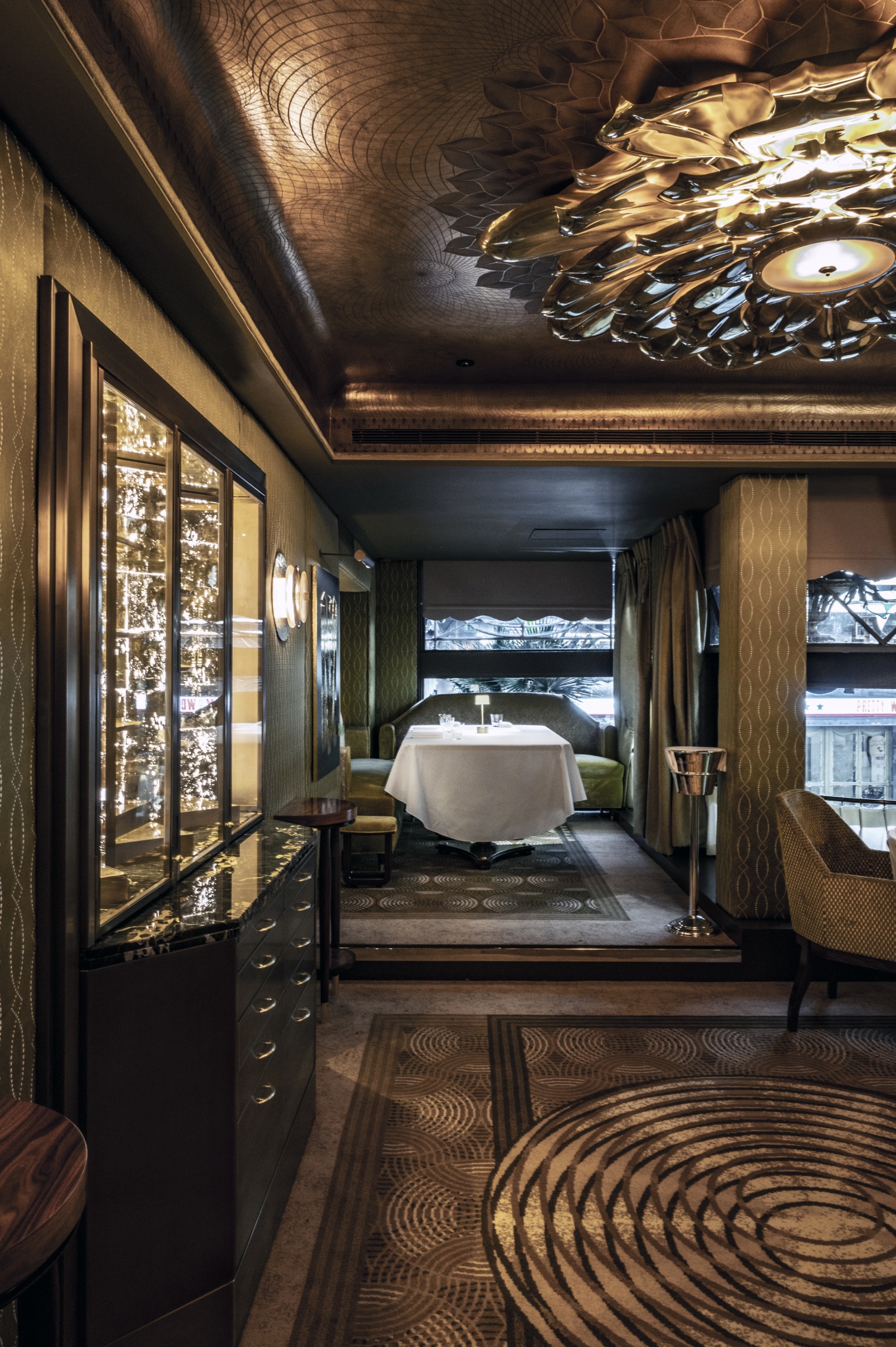 Elegant dining space for exclusive events with soft lighting and plush seating.