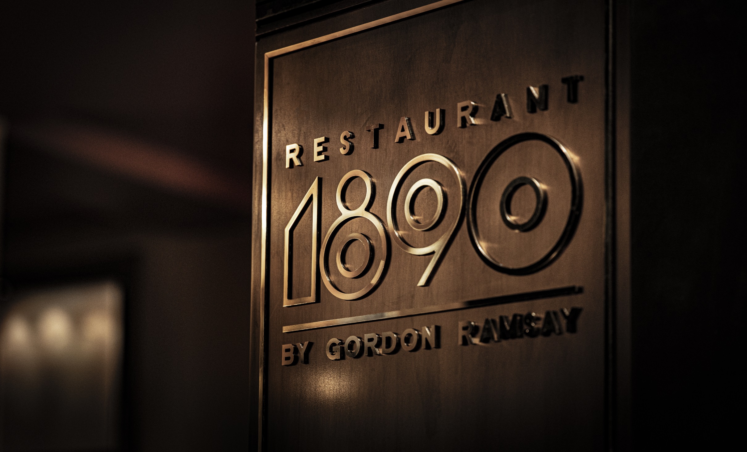 Elegant restaurant sign for Exclusive Hire 1890 by Gordon Ramsay, ideal for upscale events.