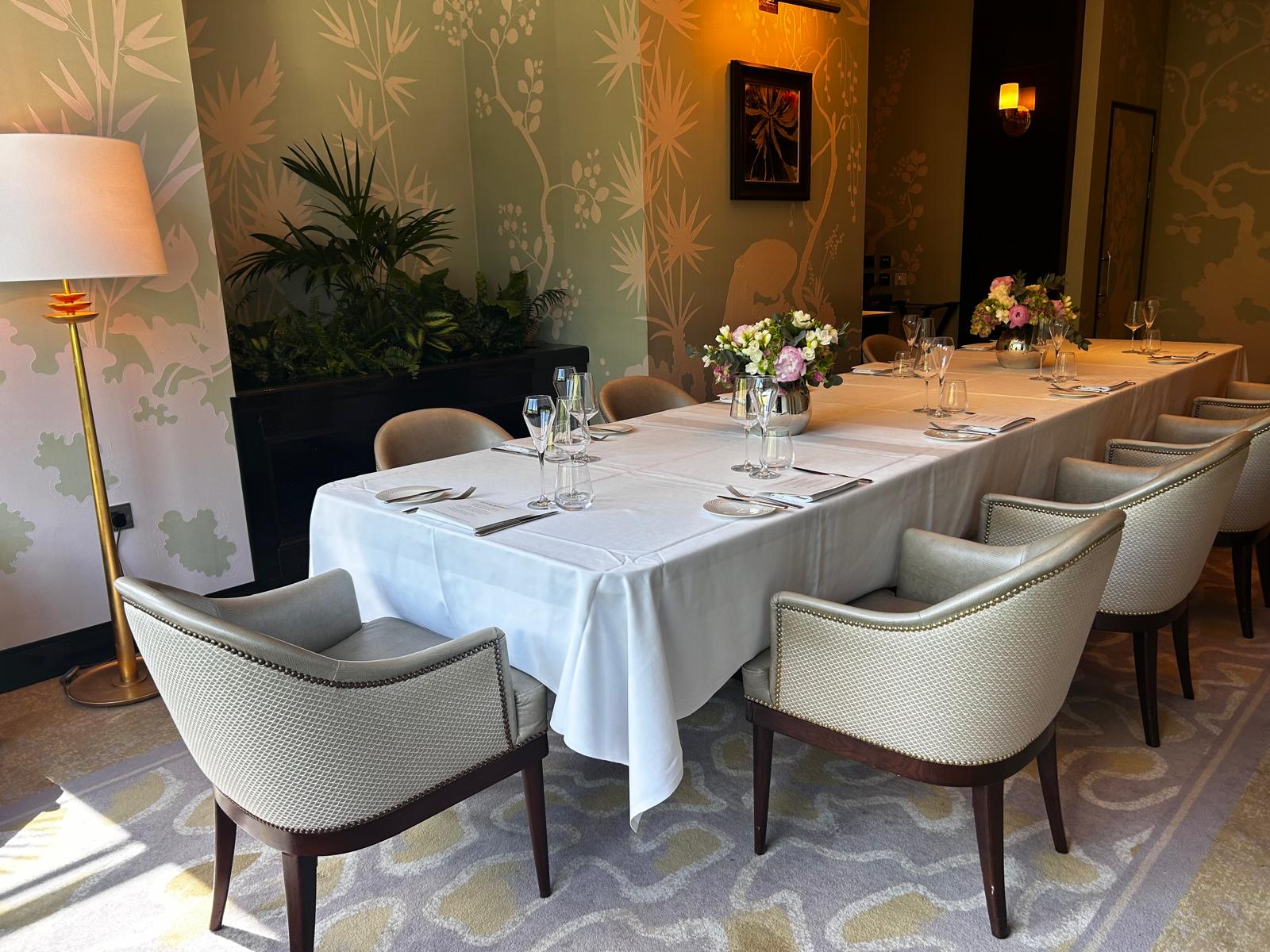 Private room at The River Restaurant with elegant table setup for meetings and gatherings.