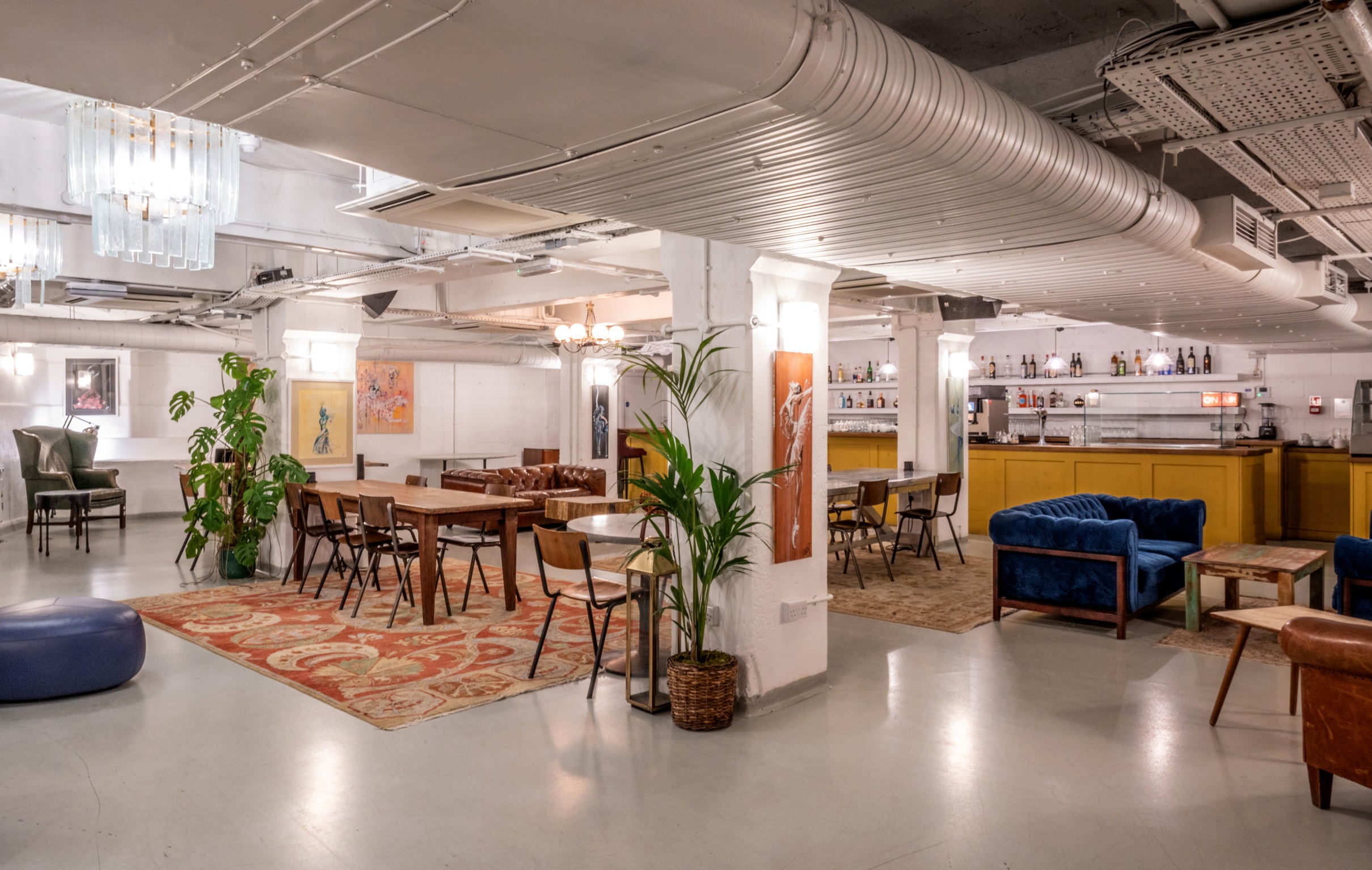 Versatile event space at Pizza East with modern decor, ideal for meetings and gatherings.