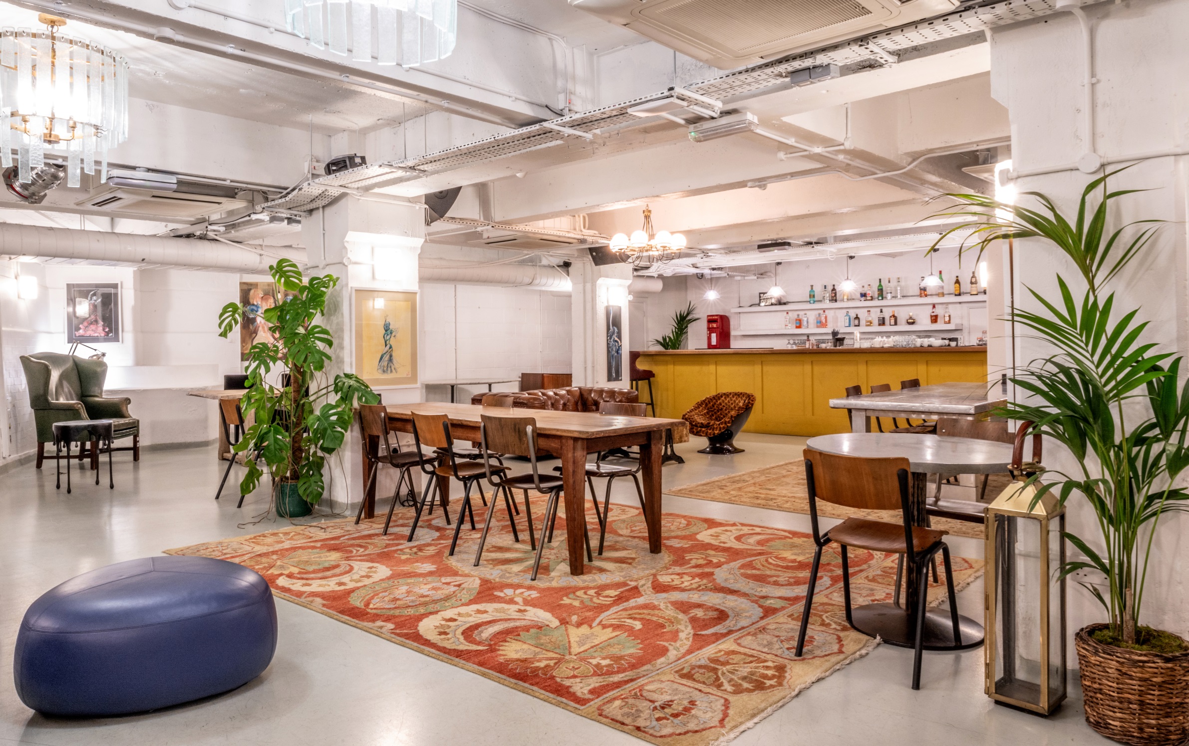 Versatile event space at Pizza East with warm decor, ideal for meetings and gatherings.