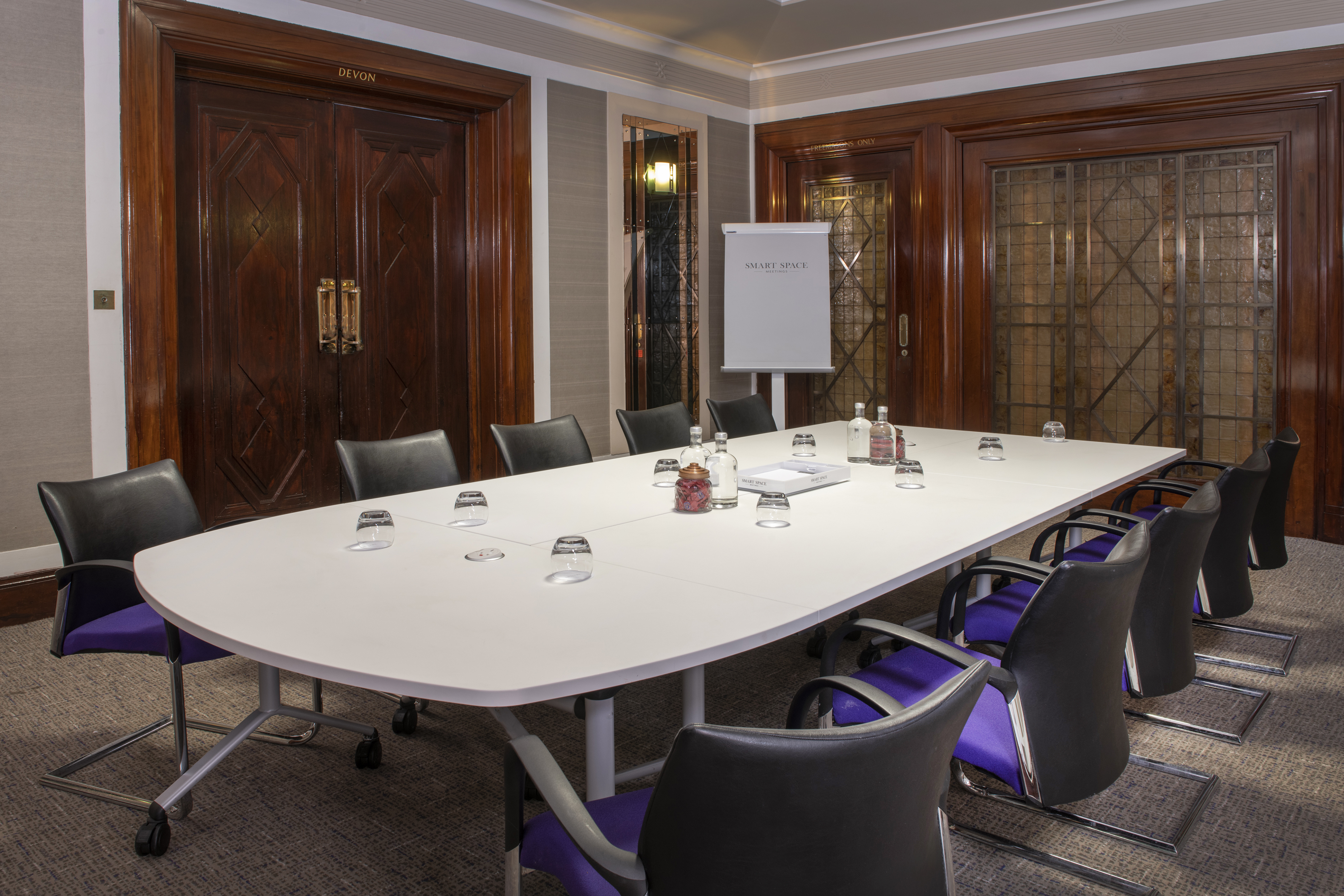 Norfolk Suite meeting room with elongated table, ideal for professional workshops.