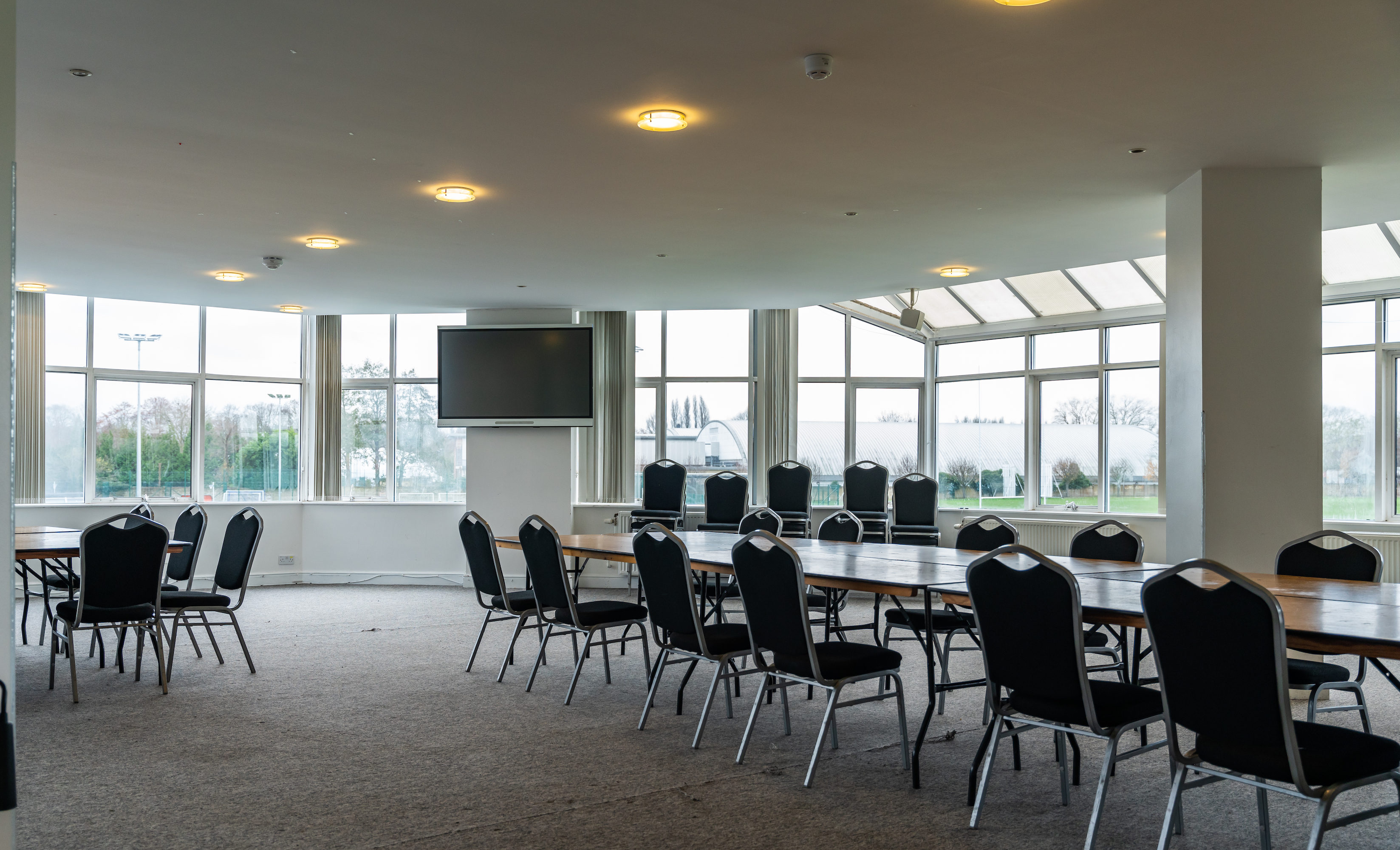 Indoor venue hire at King's House School with large windows for events and presentations.