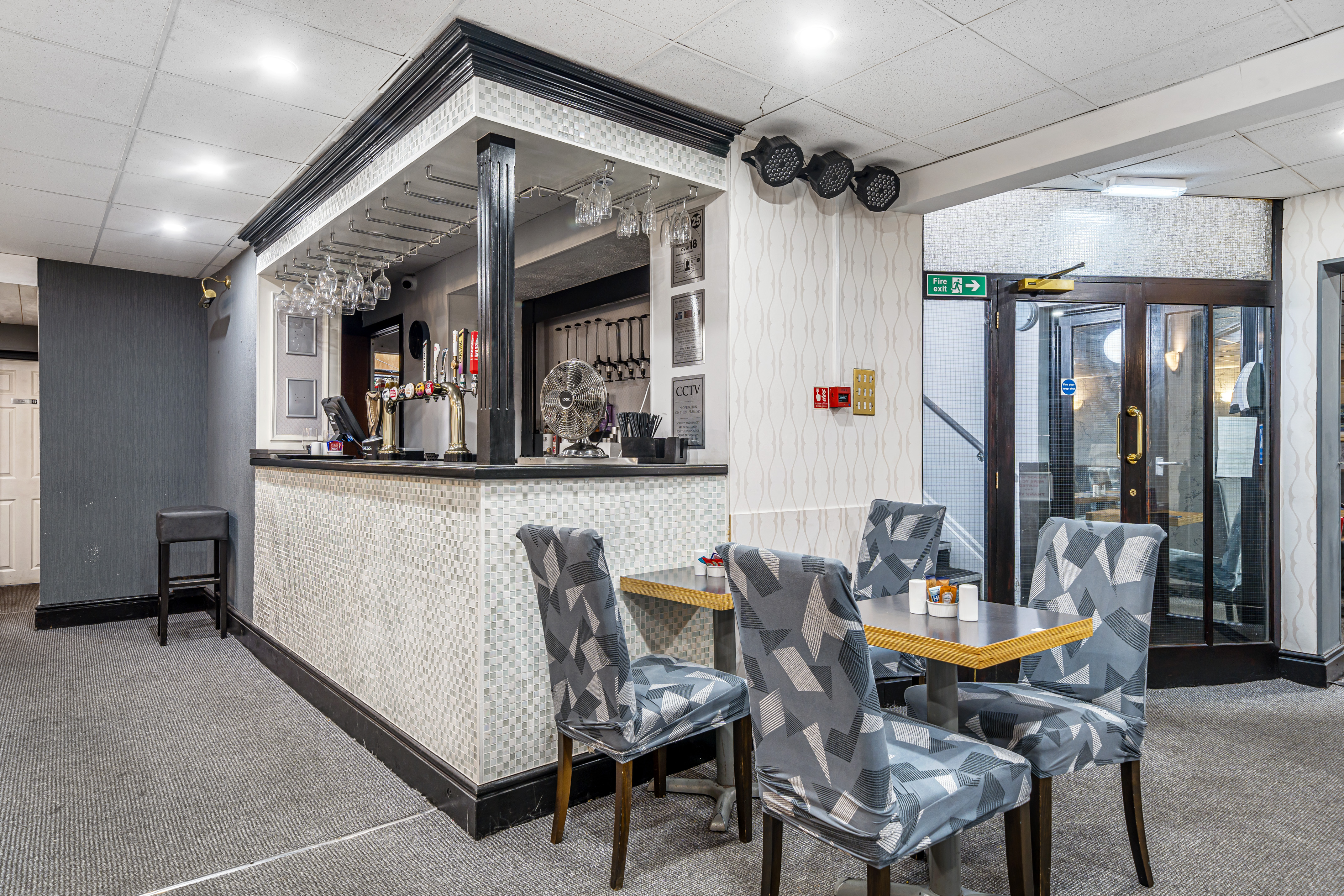 "Stylish bar area in Bluewaters Hotel Meeting Room 1 for networking events."