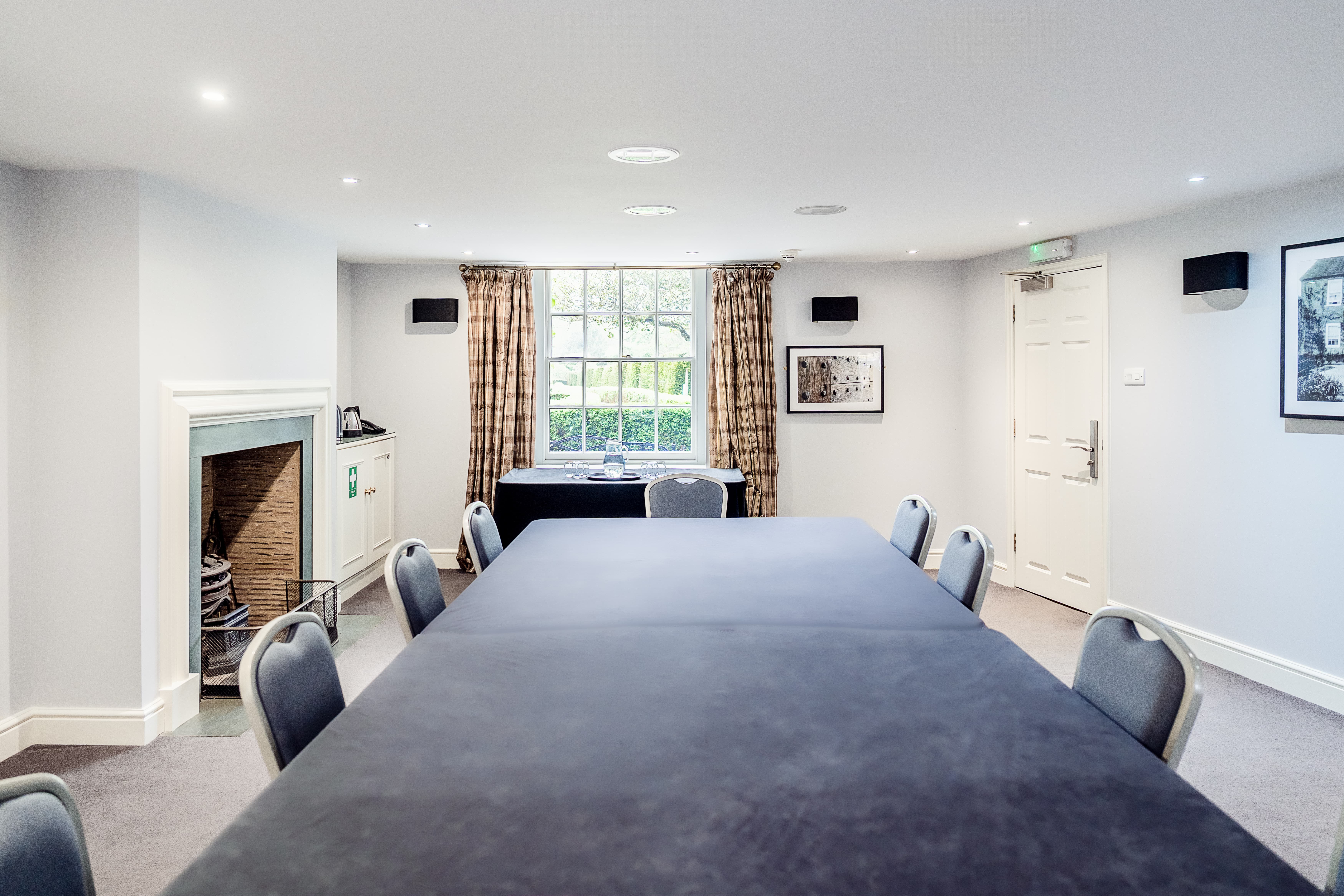 Boardroom at The Garden House, Leeds Castle: elegant meeting space with fireplace for hire.