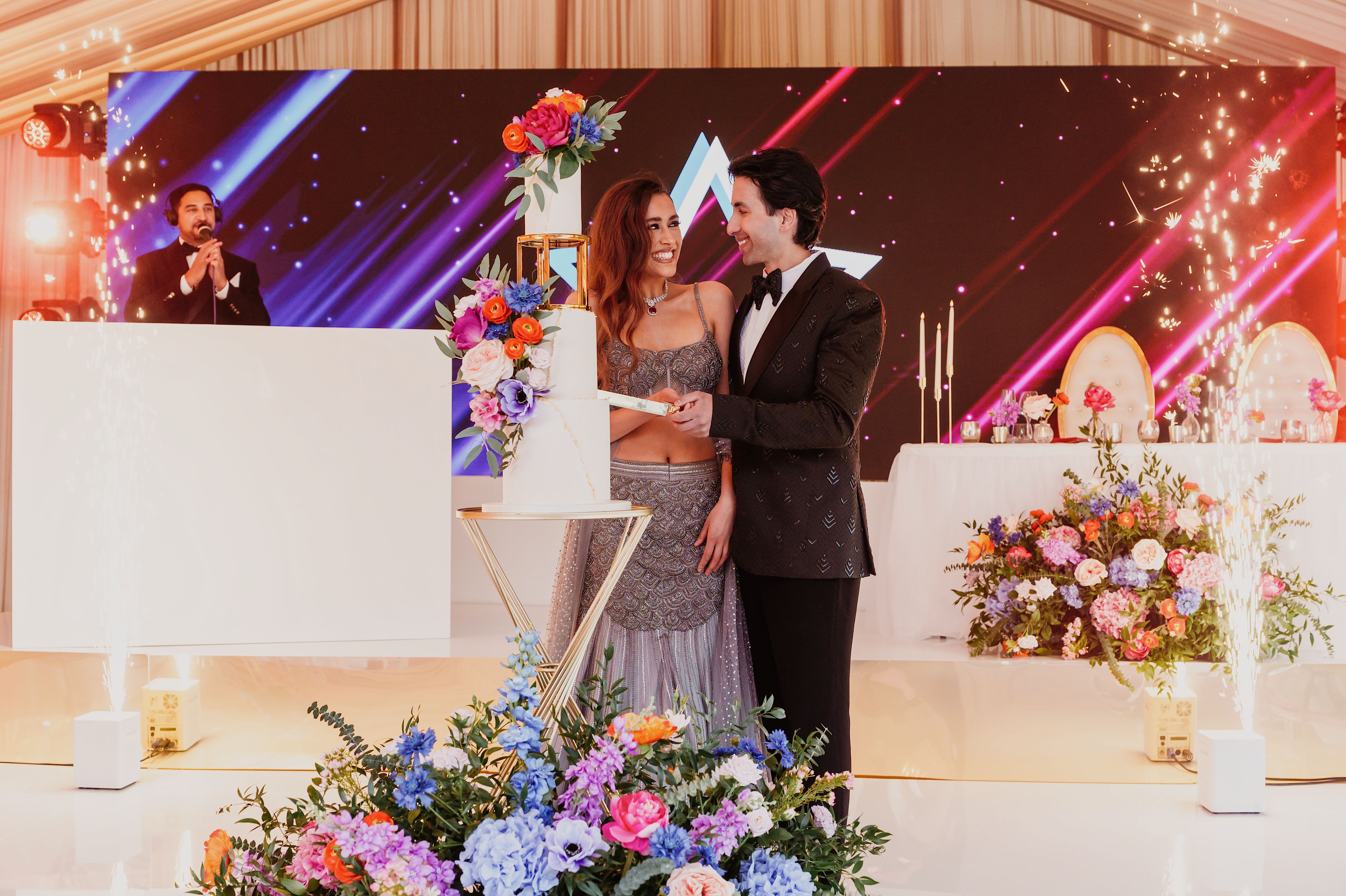 Wedding reception at Leeds Castle featuring LED backdrop and pyrotechnics for luxury event hire.