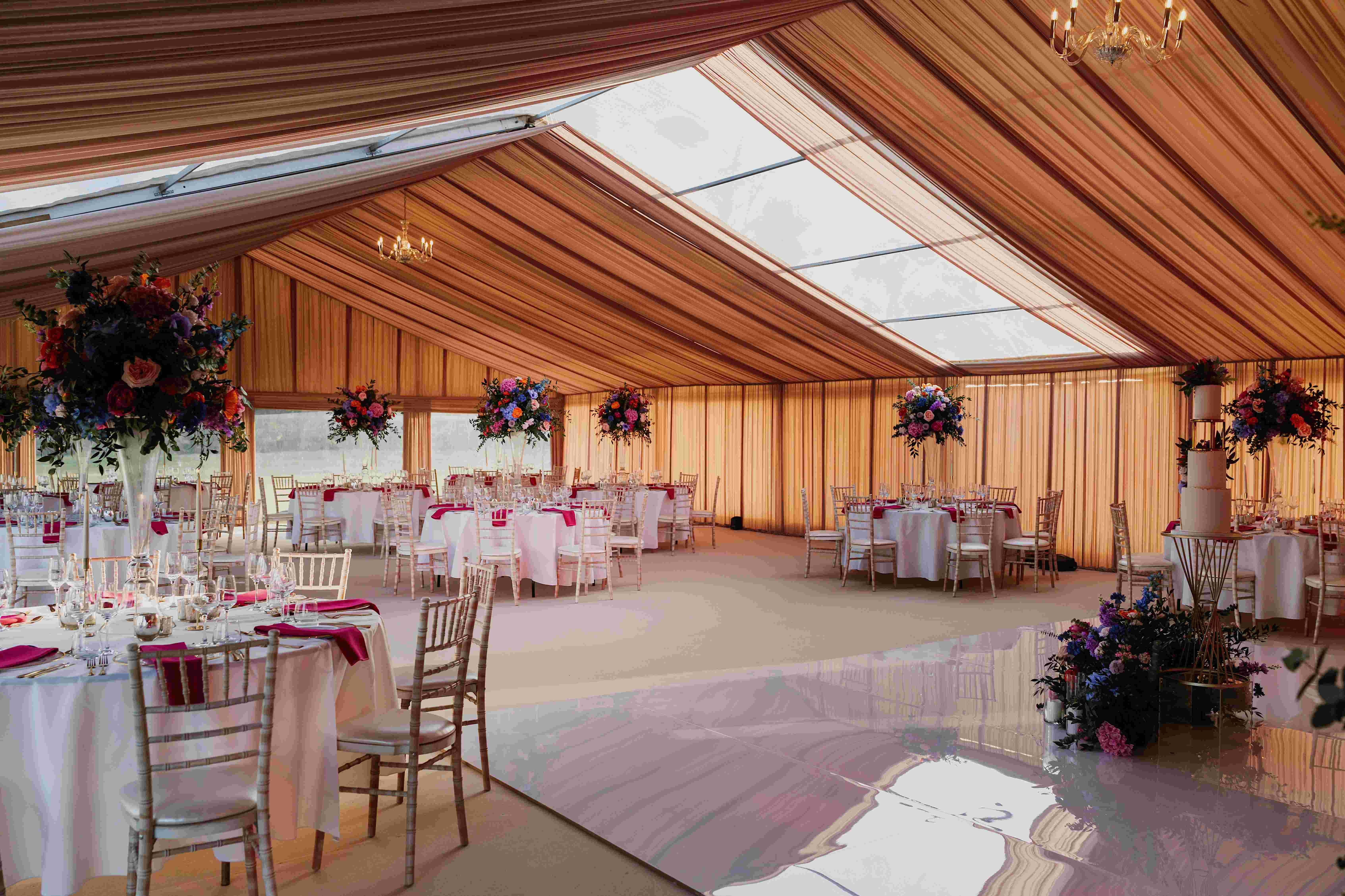 Luxury marquee with clear-span roof for weddings and corporate events at Leeds Castle.