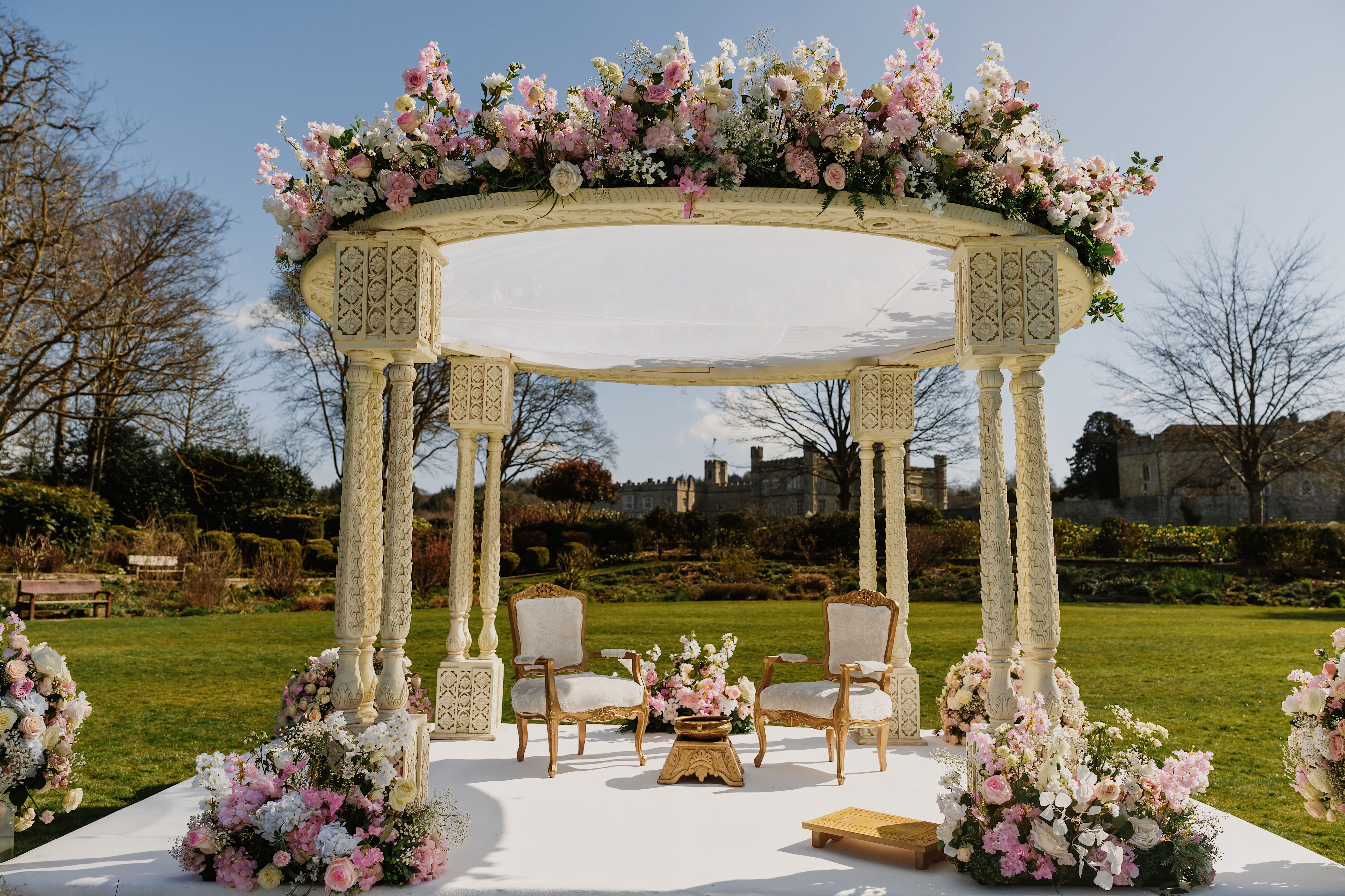 Outdoor mandap ceremony at Leeds Castle, perfect for luxury wedding venue events.
