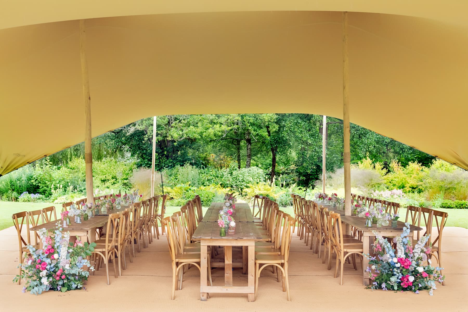 Elegant stretch tent marquee for garden weddings and upscale outdoor events at Leeds Castle.
