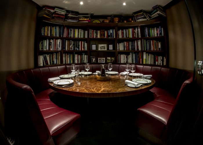 Intimate meeting space at The Kitchen Library for executive dining and discussions.