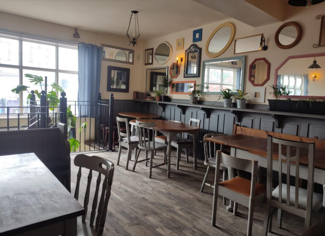 Cozy Stamps Bar with eclectic decor, perfect for workshops and networking events.