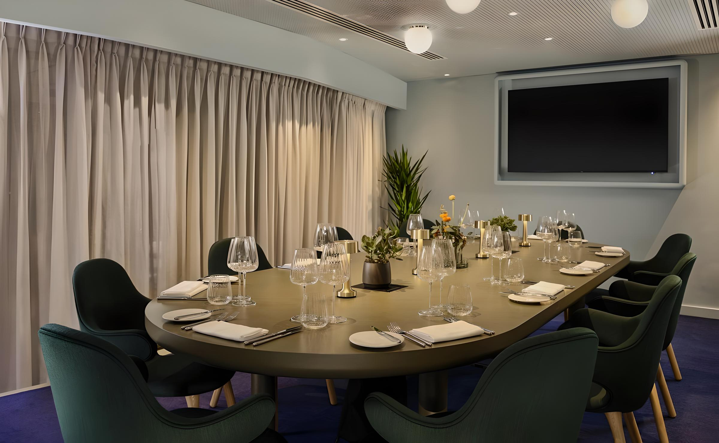 Creative Room 6 at art'otel London: elegant meeting space for corporate events and presentations.