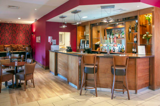 Stylish bar area at The Milestone Hotel, ideal for networking events and gatherings.