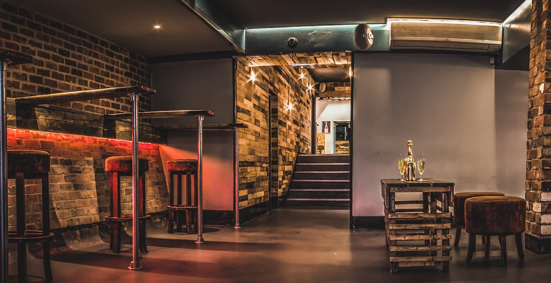 Stylish industrial event space with exposed brick for cocktail receptions and private parties.