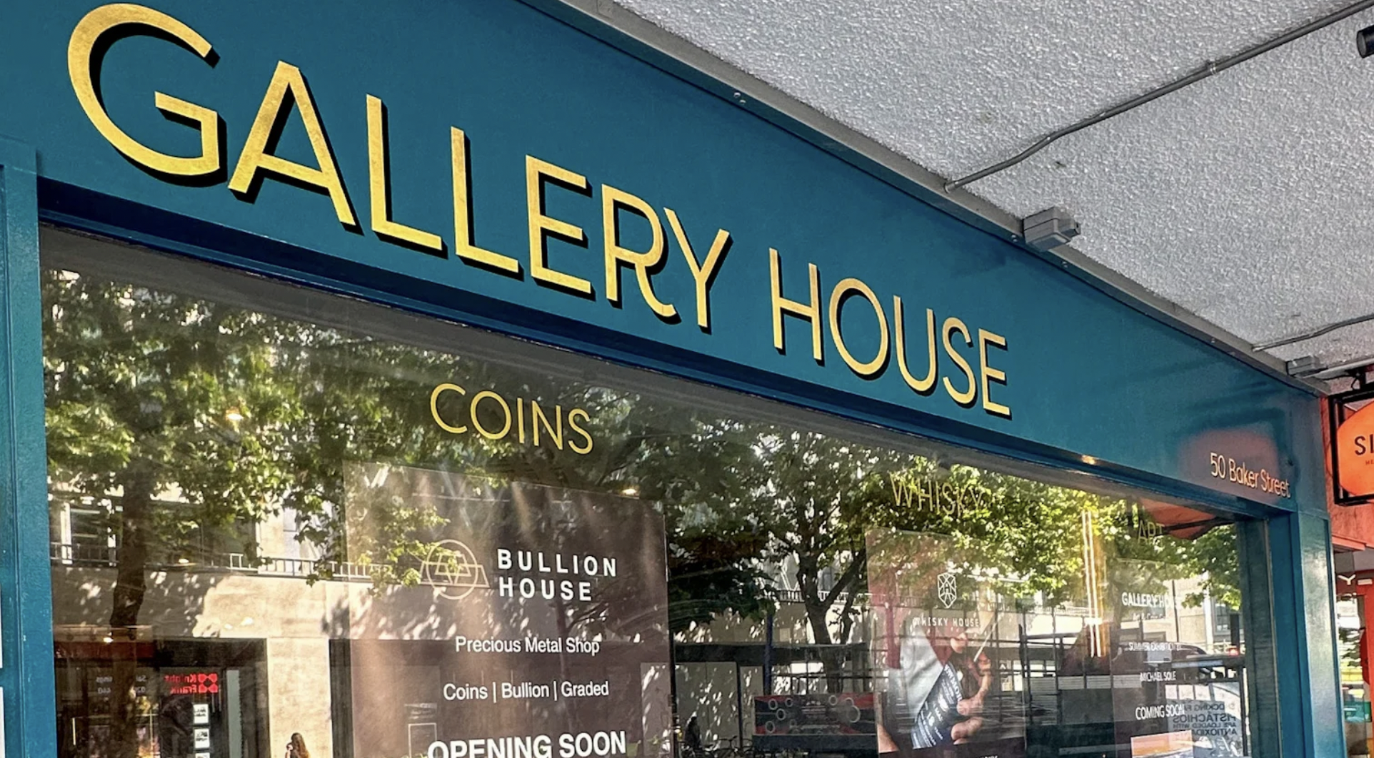 Gallery House storefront with "Opening Soon" sign for coin and bullion events.