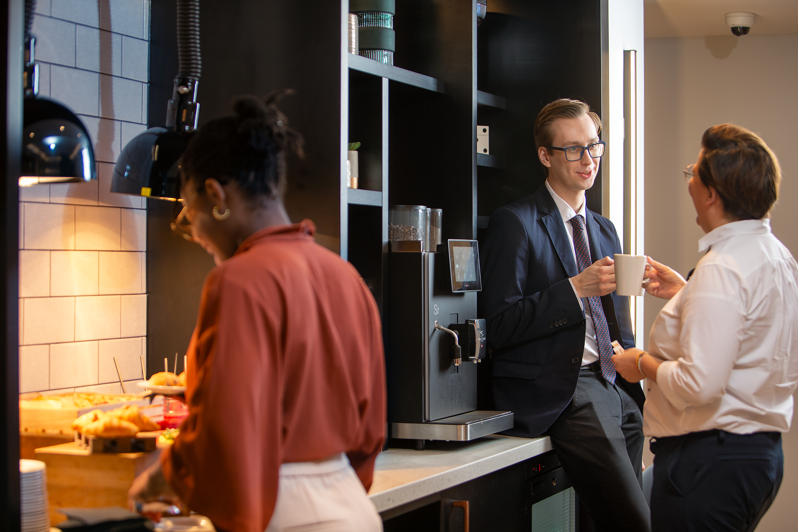 Networking break at Royal National Hotel with coffee station for collaboration and connections.