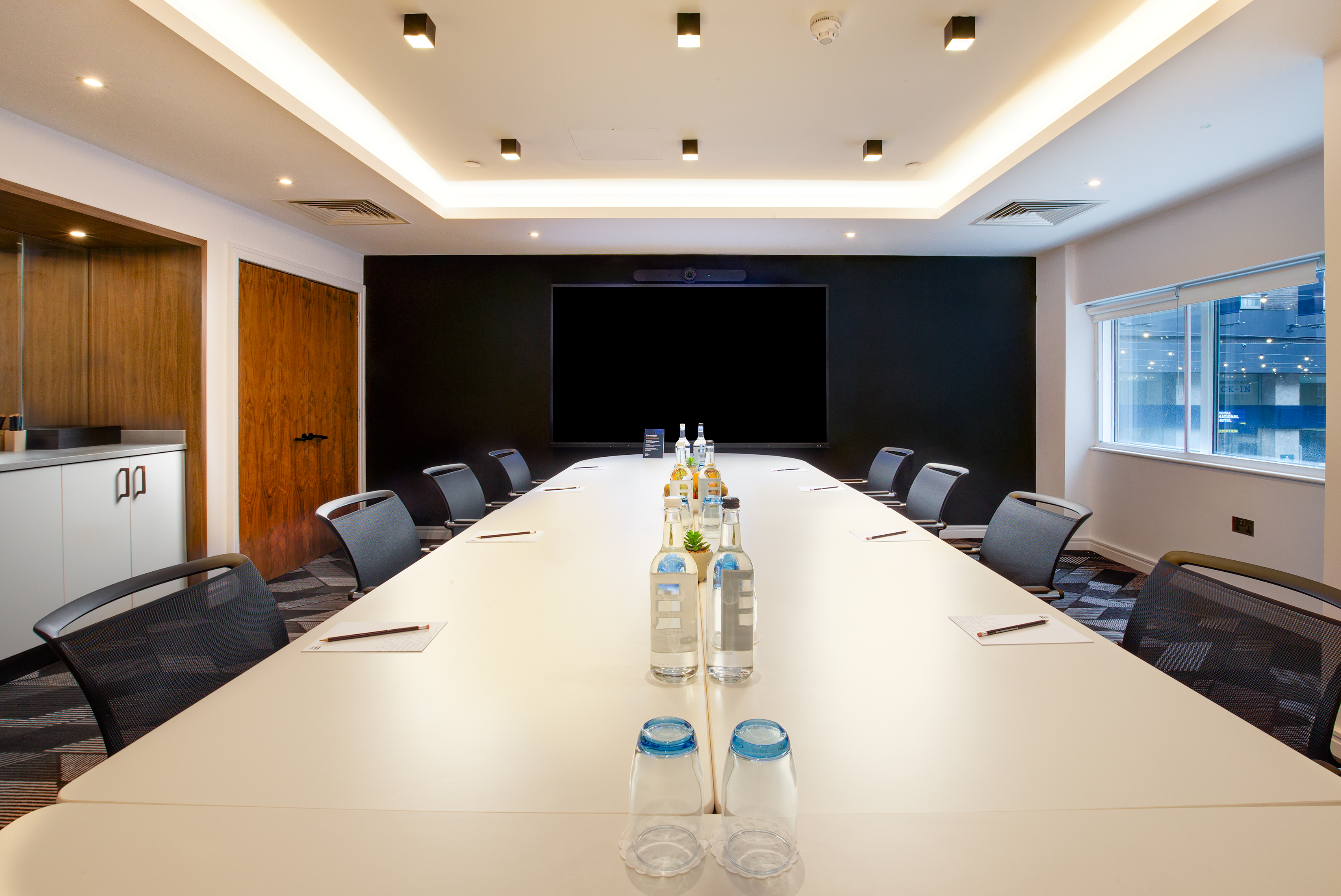 Modern conference room at Royal National Hotel, ideal for professional meetings and presentations.