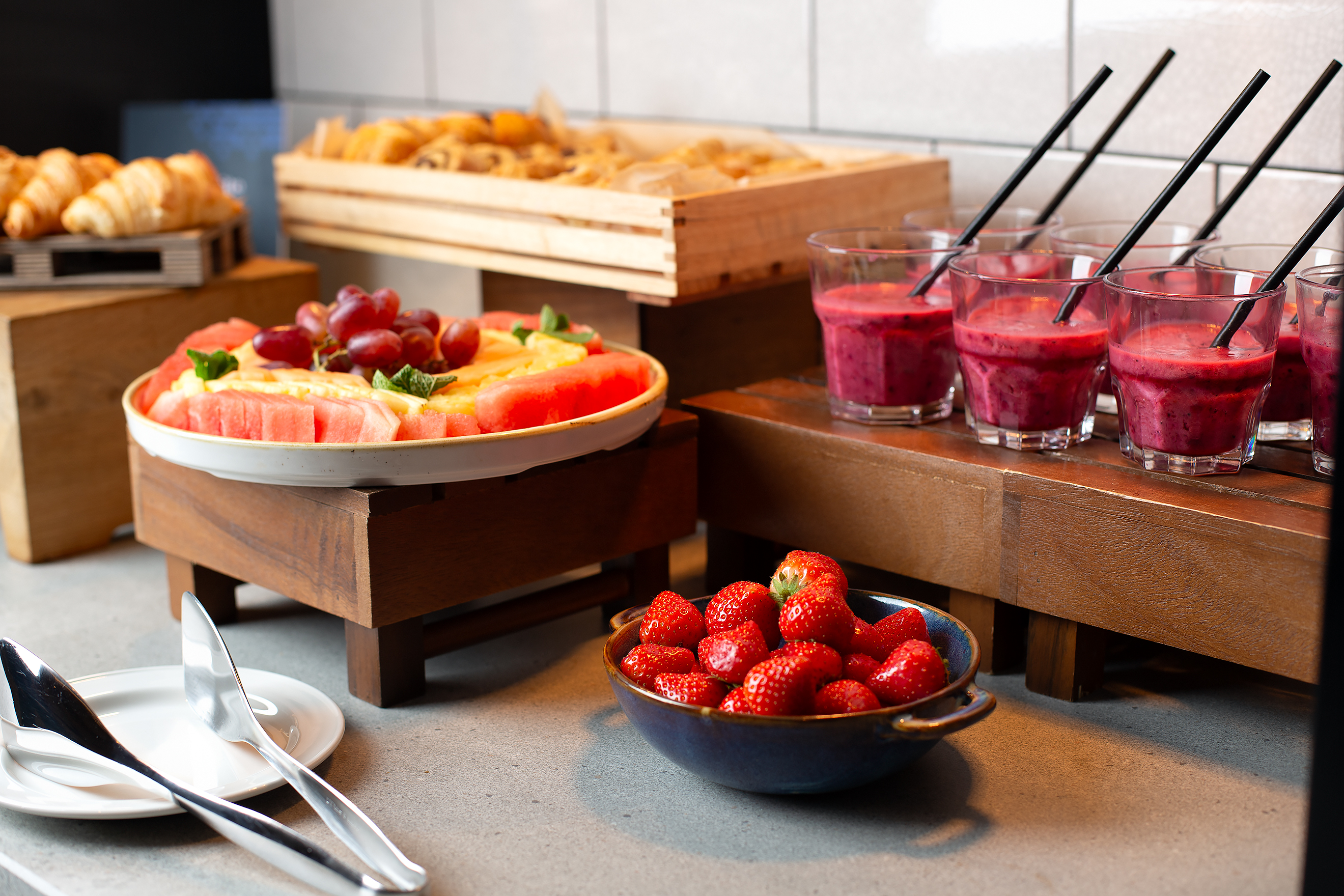 Vibrant breakfast spread with fresh fruit and pastries at Royal National Hotel event.