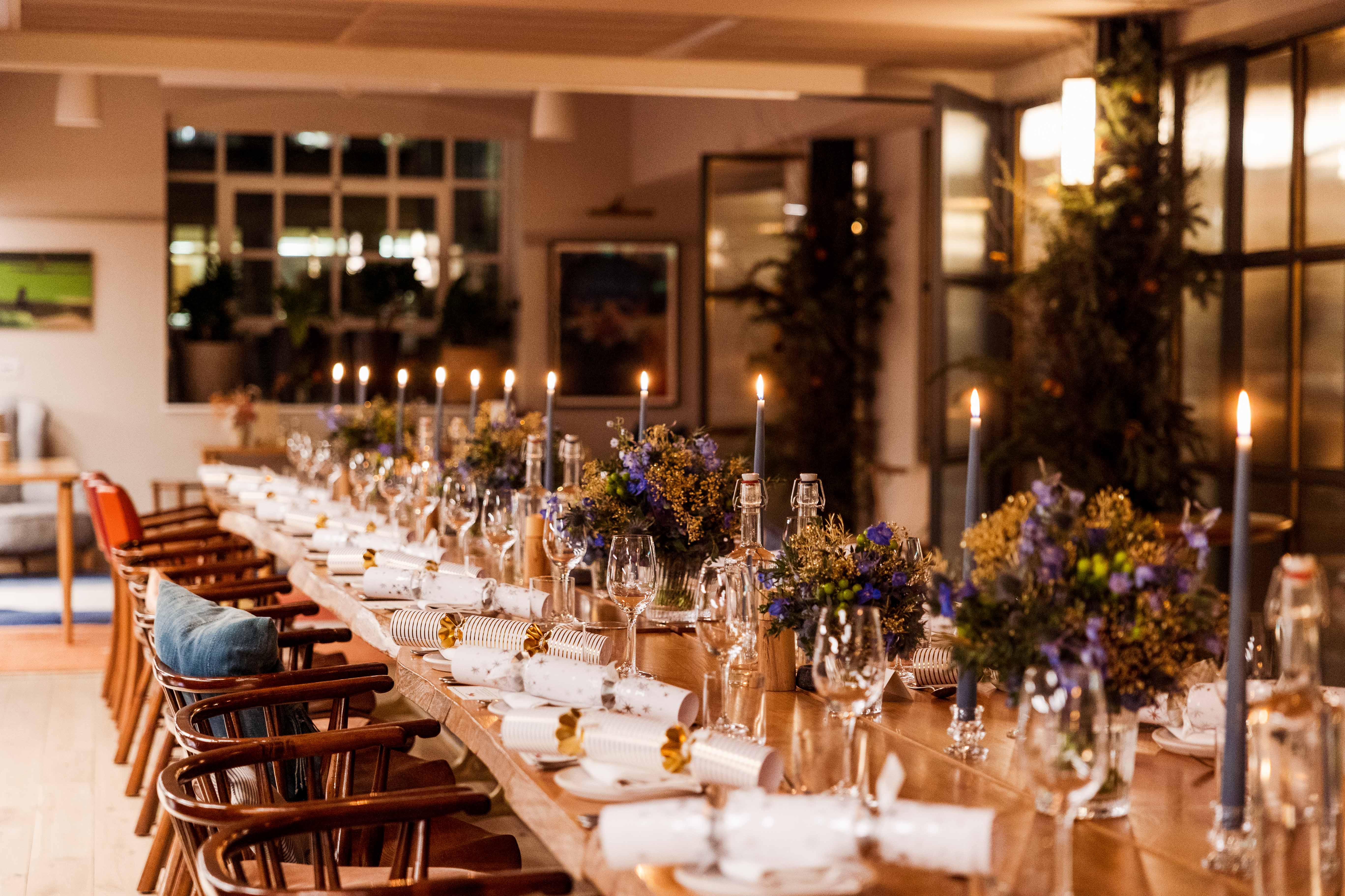 Elegant dining table with floral arrangements for corporate events or dinner parties.