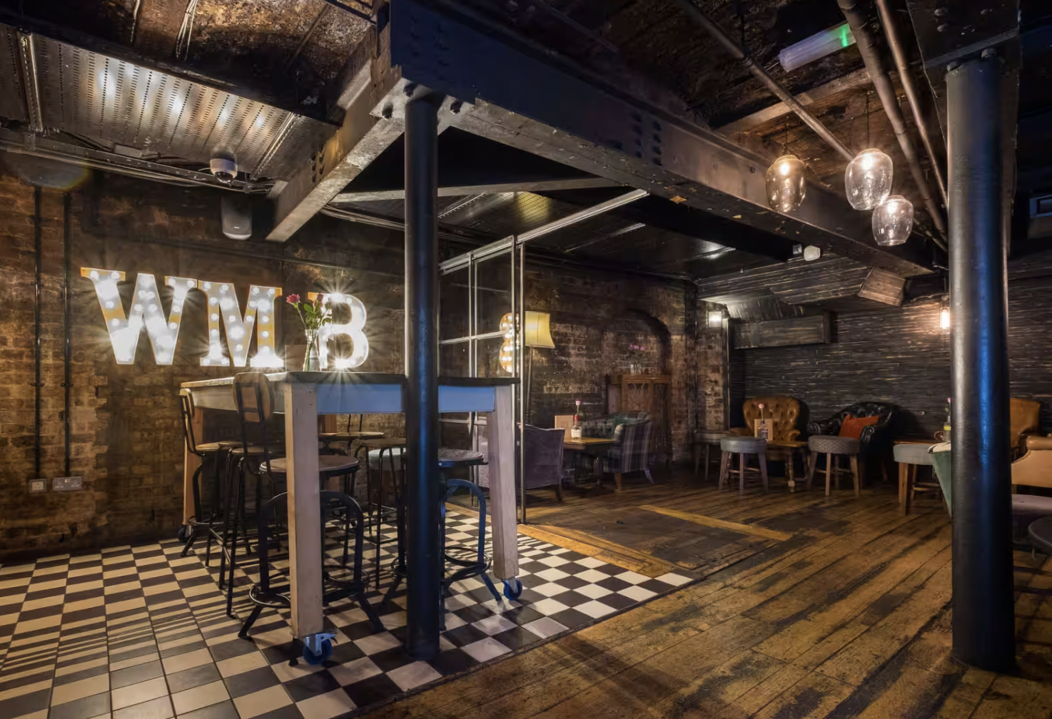 Stylish industrial venue with exposed brick for corporate events and gatherings.