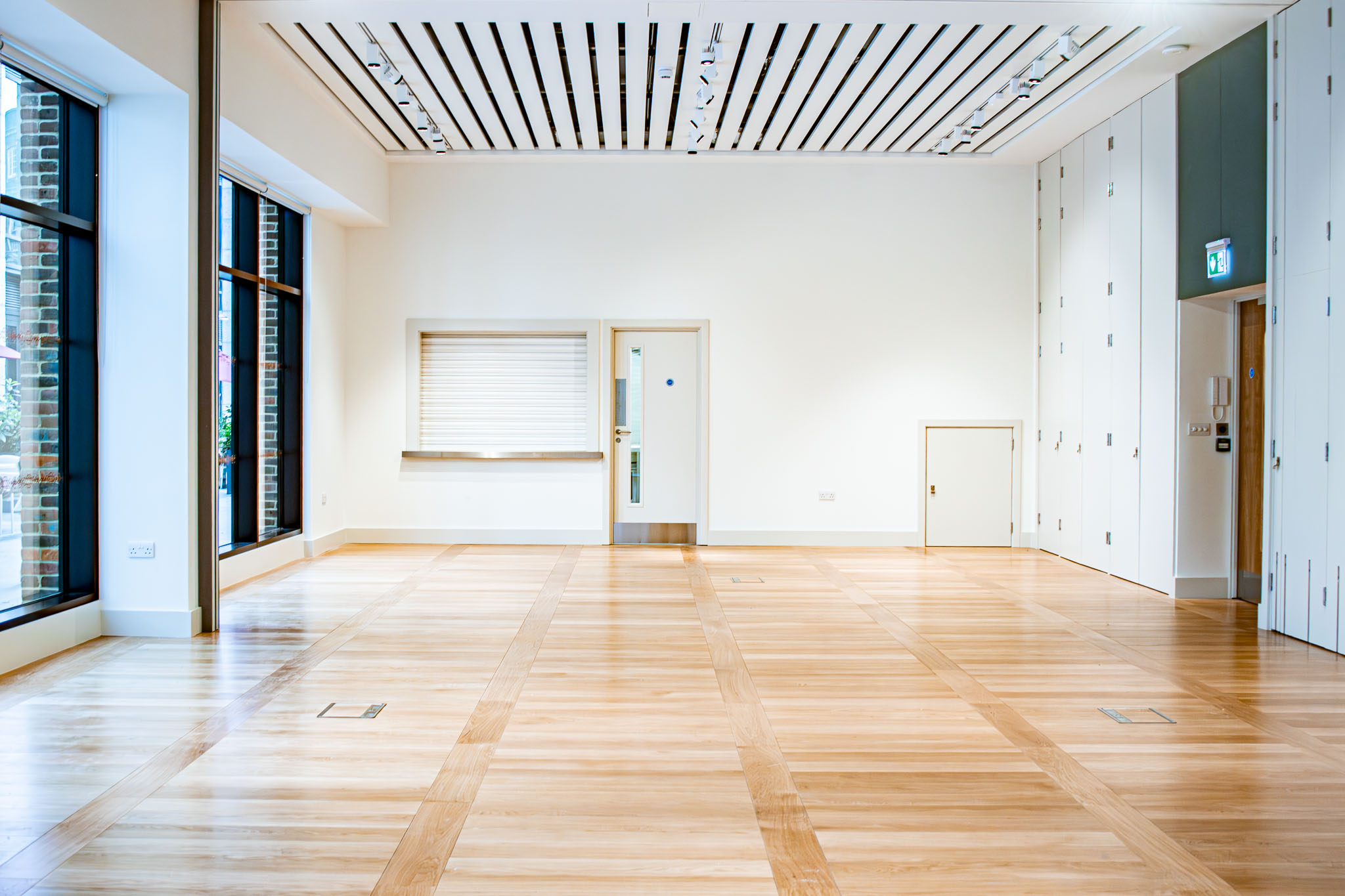 Versatile event space with natural light, ideal for corporate meetings and workshops.