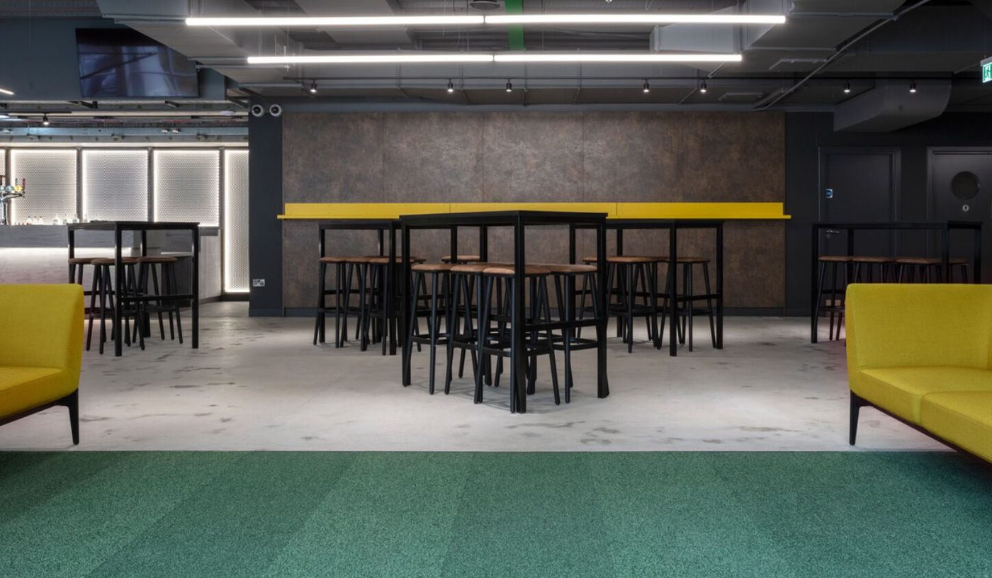 Albion Bar at Hibernian FC: modern event space with high-top tables for networking.