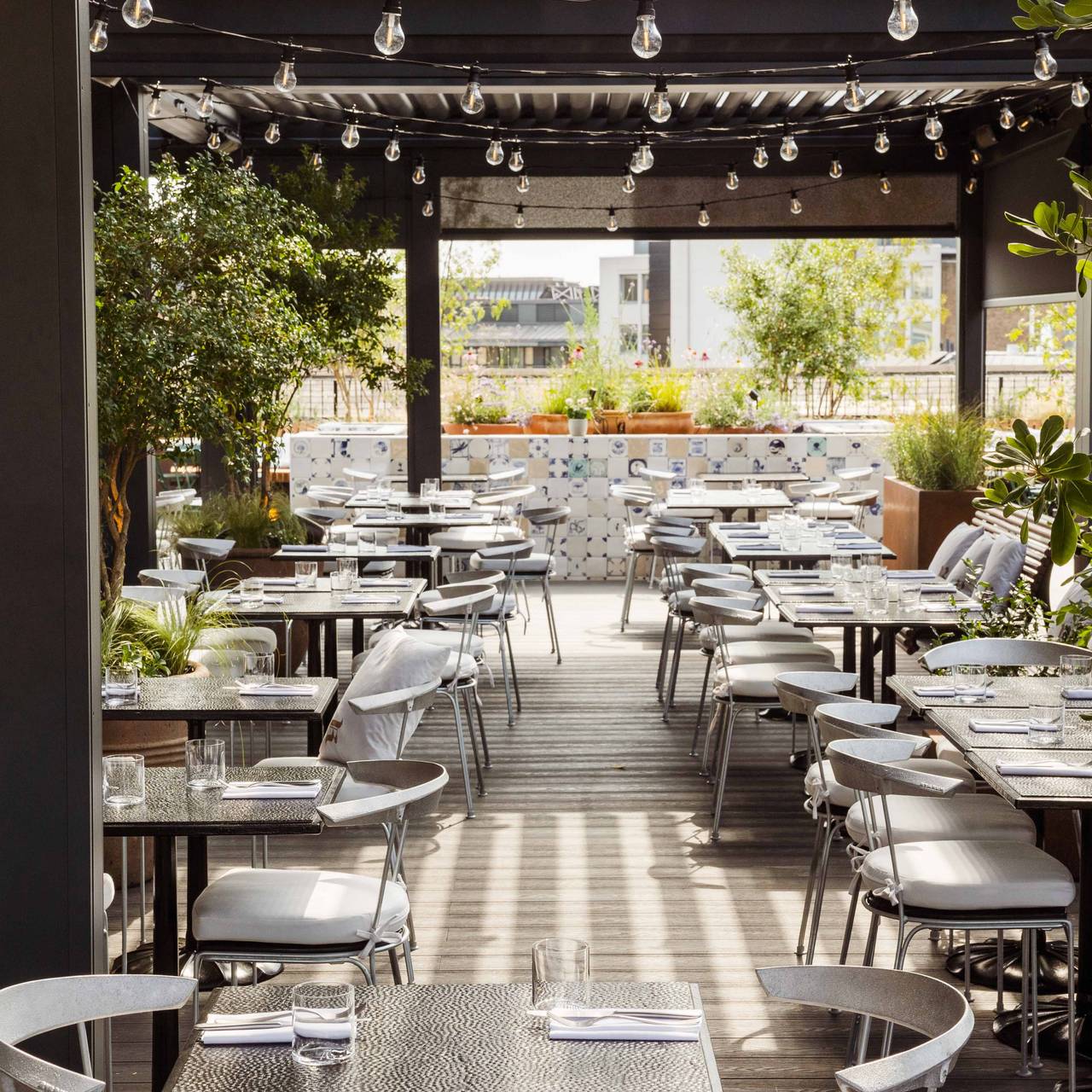 Stylish outdoor dining at Rooftop Restaurant, ideal for events and gatherings.