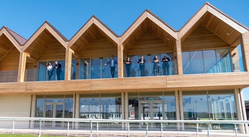 Modern meeting rooms at Catterick Racecourse with spacious balcony for networking events.