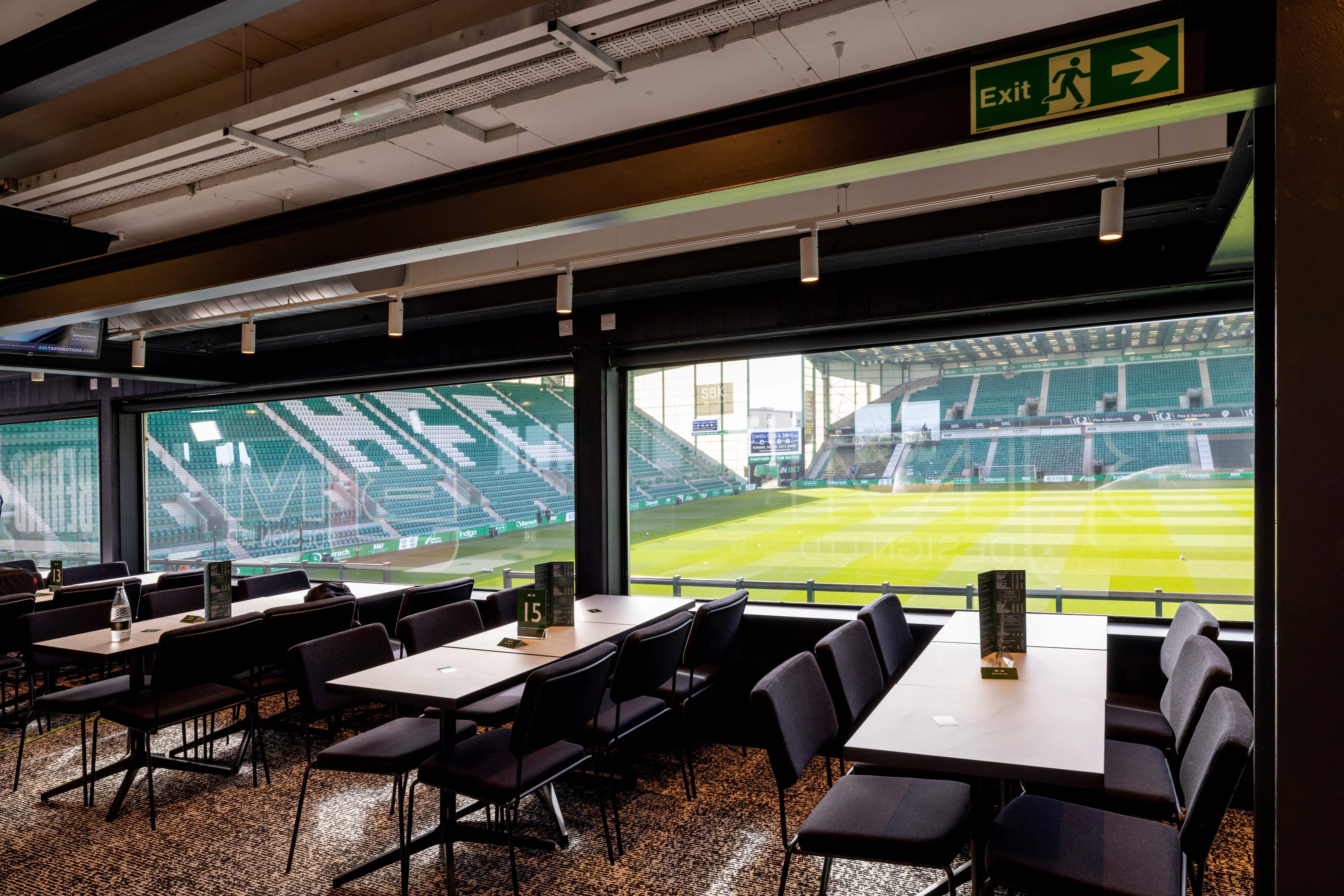 Modern event space at Hibernian FC with panoramic field view for corporate meetings.