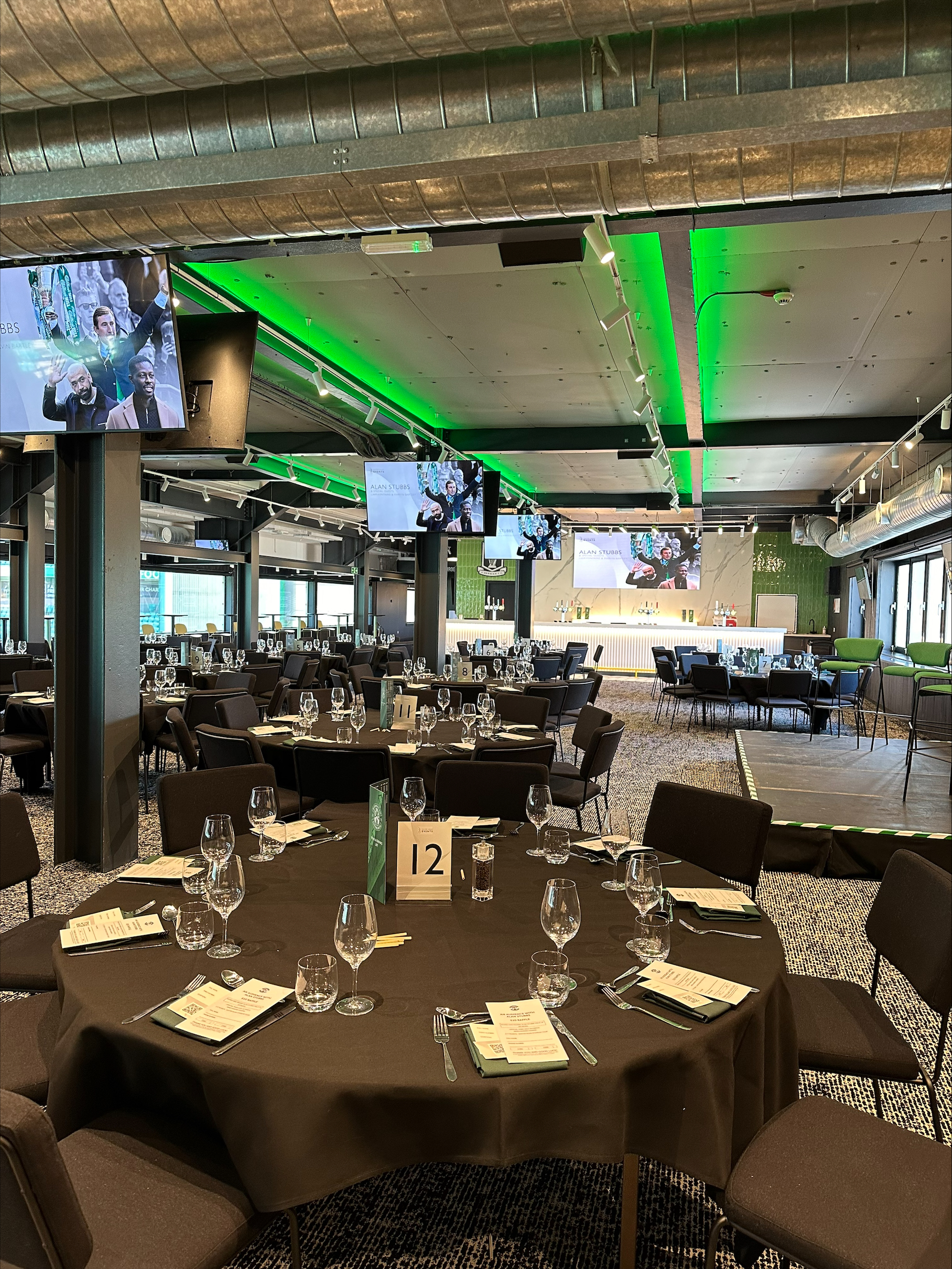 Elegant event space at Hibernian FC with round tables for formal gatherings.