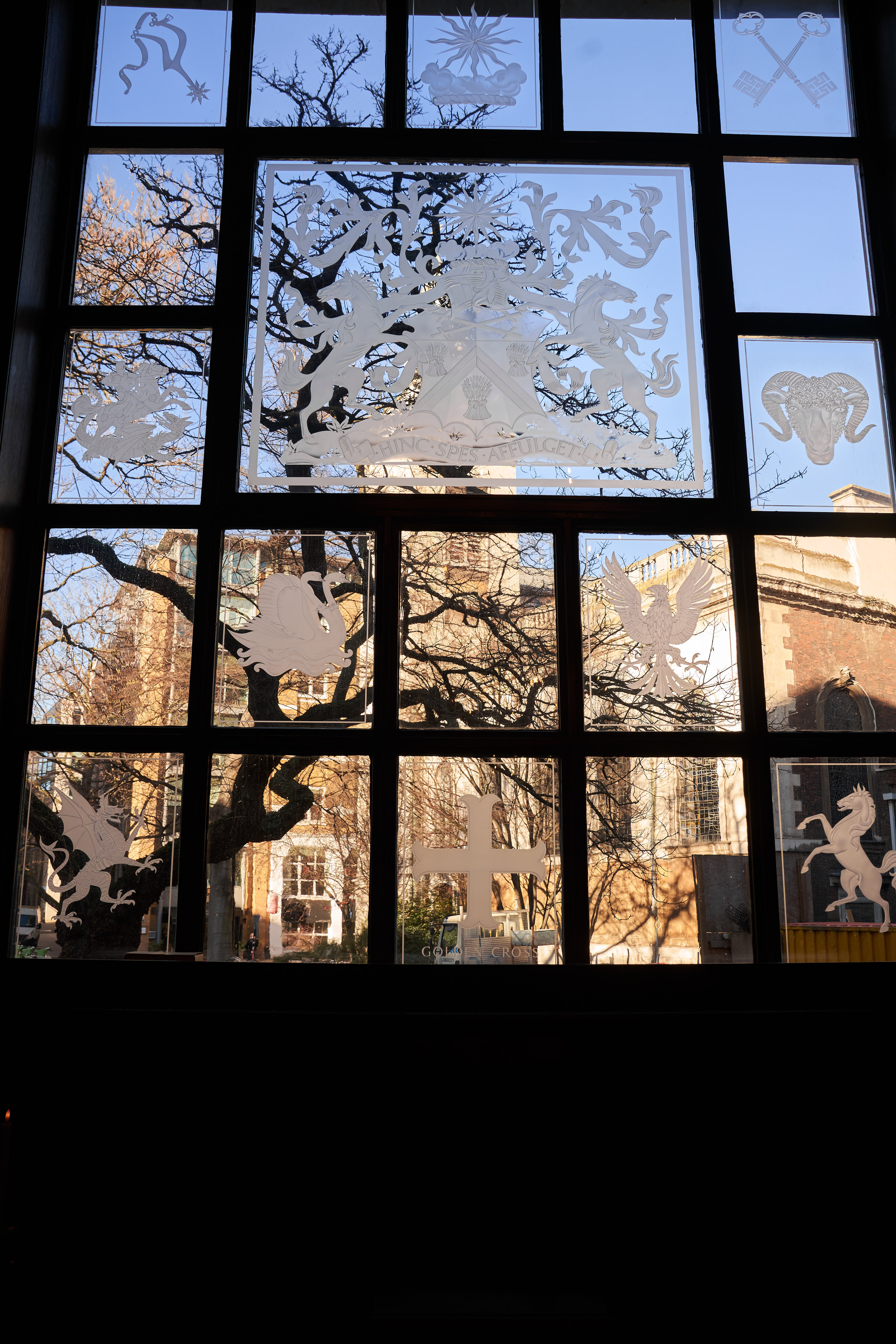 Intricate window in The Great Hall, Innholders' Hall, perfect for events and workshops.