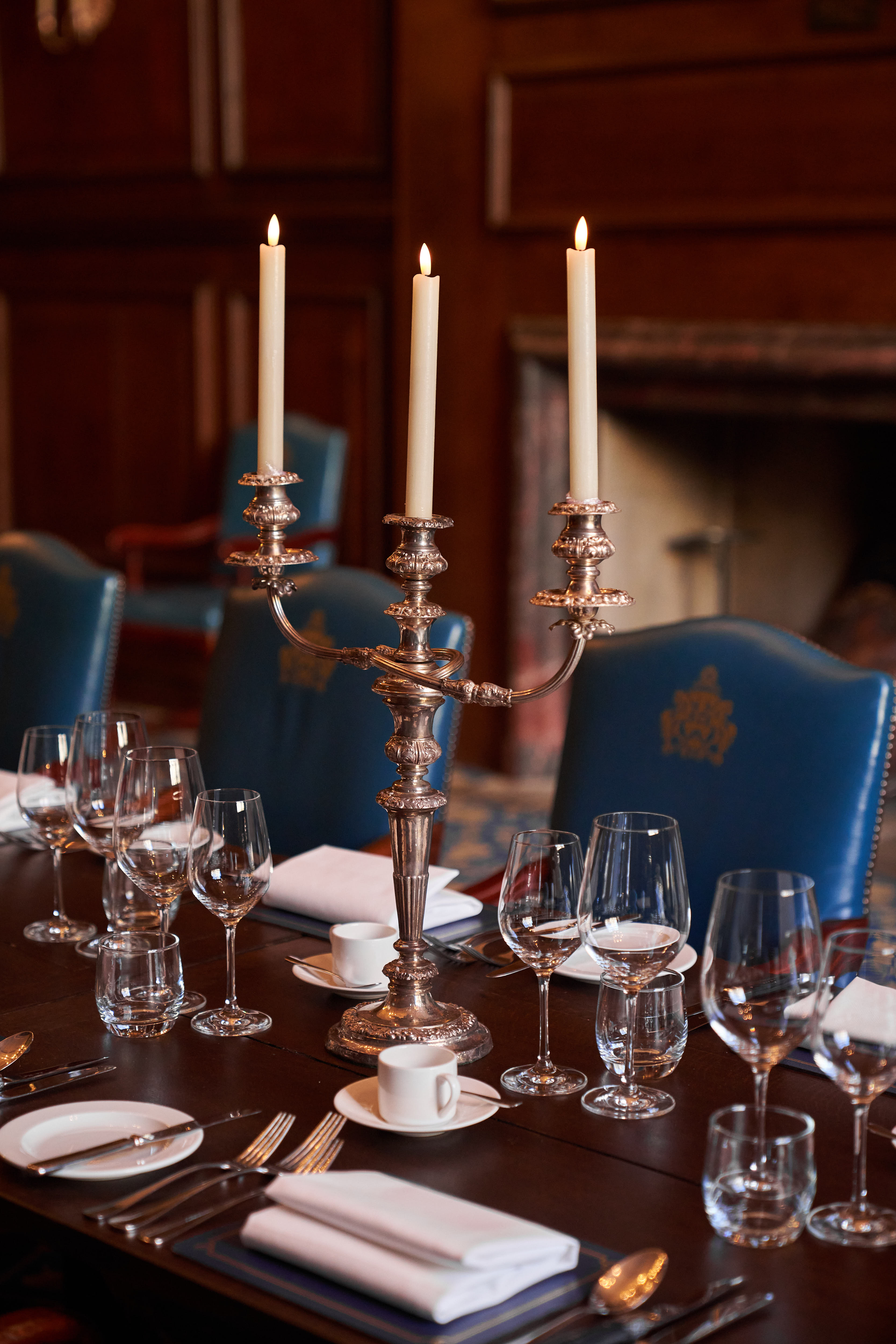 Elegant dining table in The Great Hall, featuring a silver candelabra for formal events.