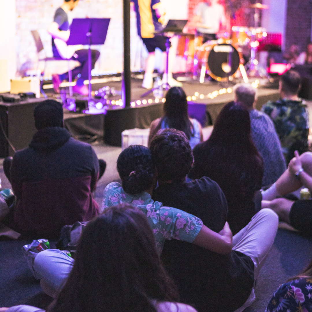 Hybrid event with live music in cozy King's House, fostering engagement and connection.