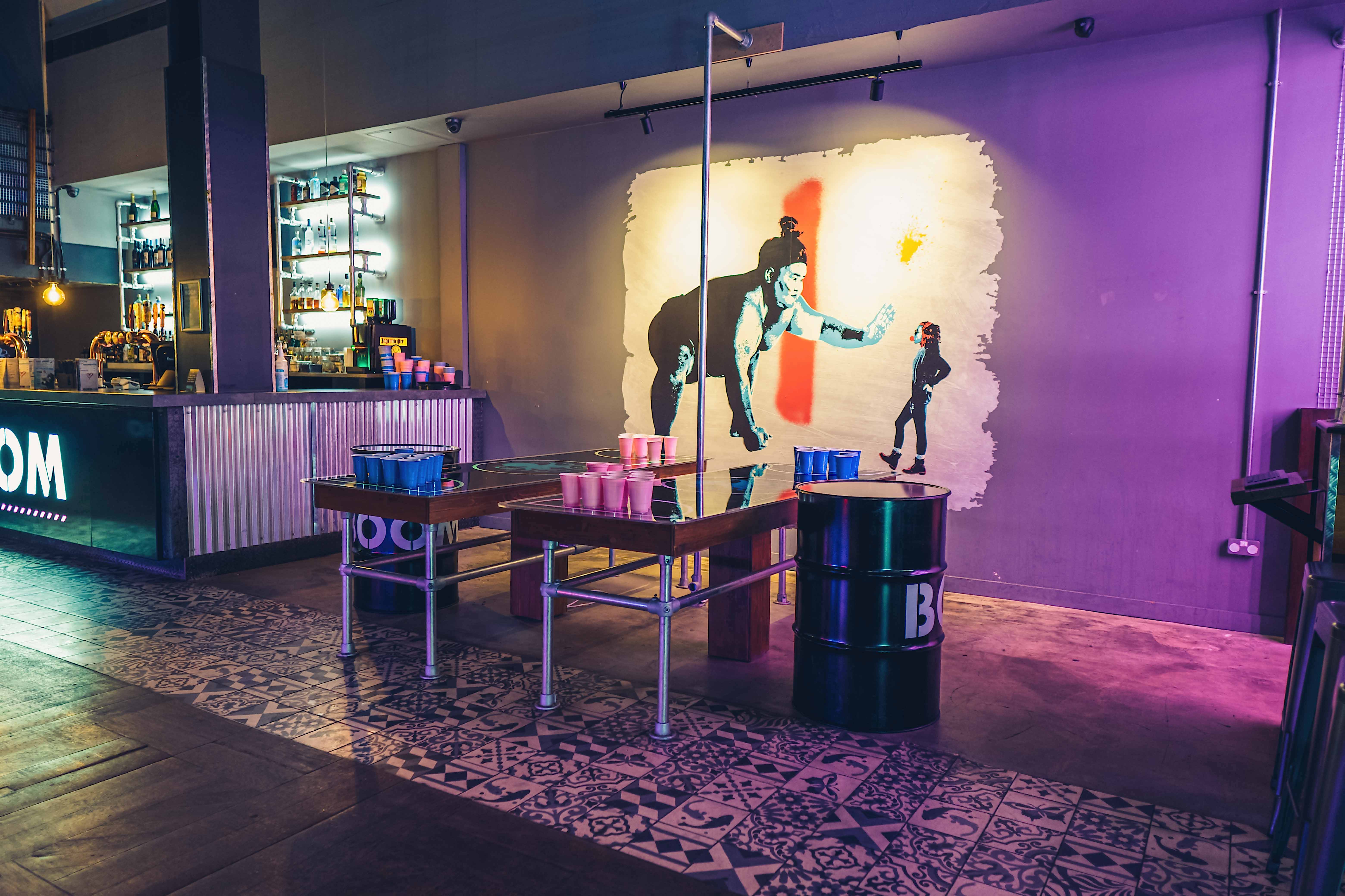 Exclusive private hire event space in Boom Battle Bar Birmingham with vibrant decor.
