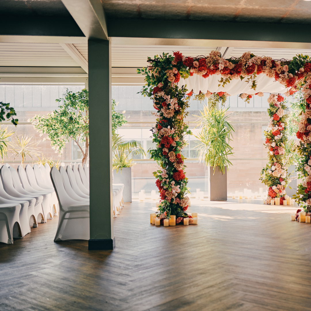 Elegant wedding venue with floral arch and soft lighting in Manchester Hall.