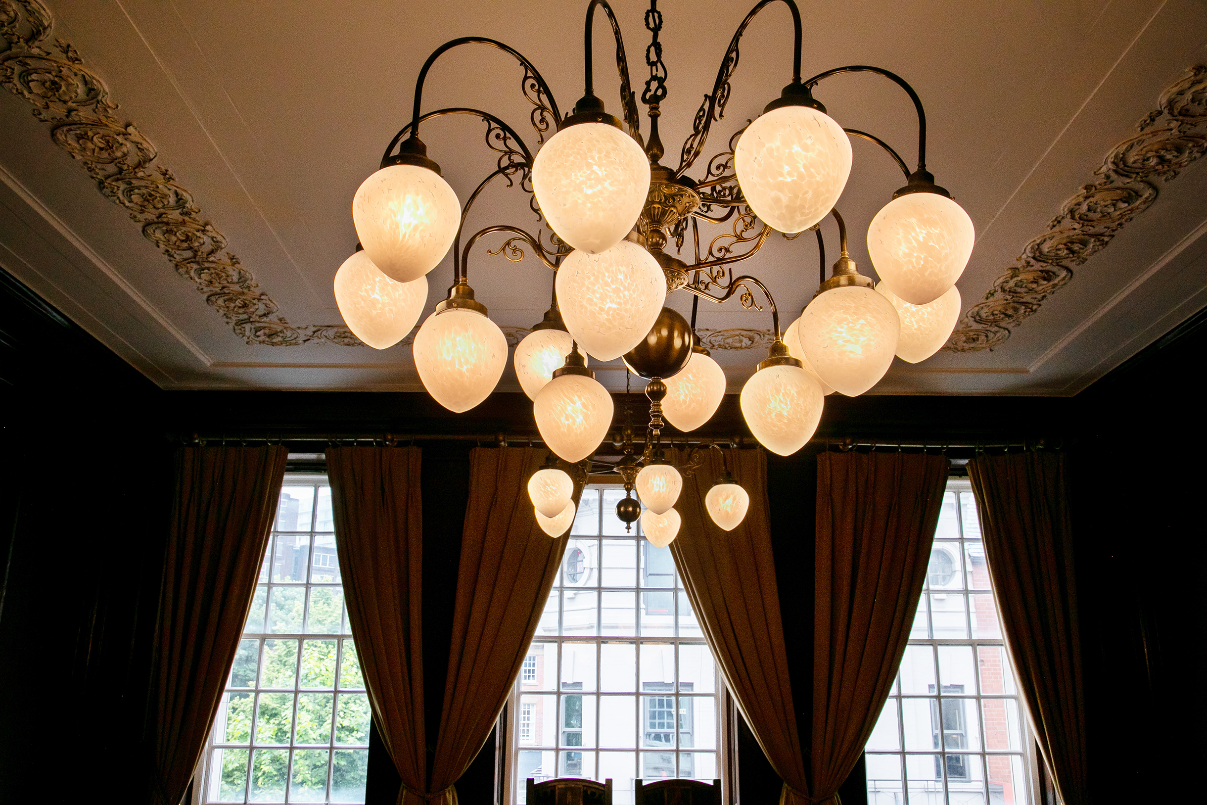 Elegant chandelier in The Drawing Room, Manchester Hall for upscale events and gatherings.