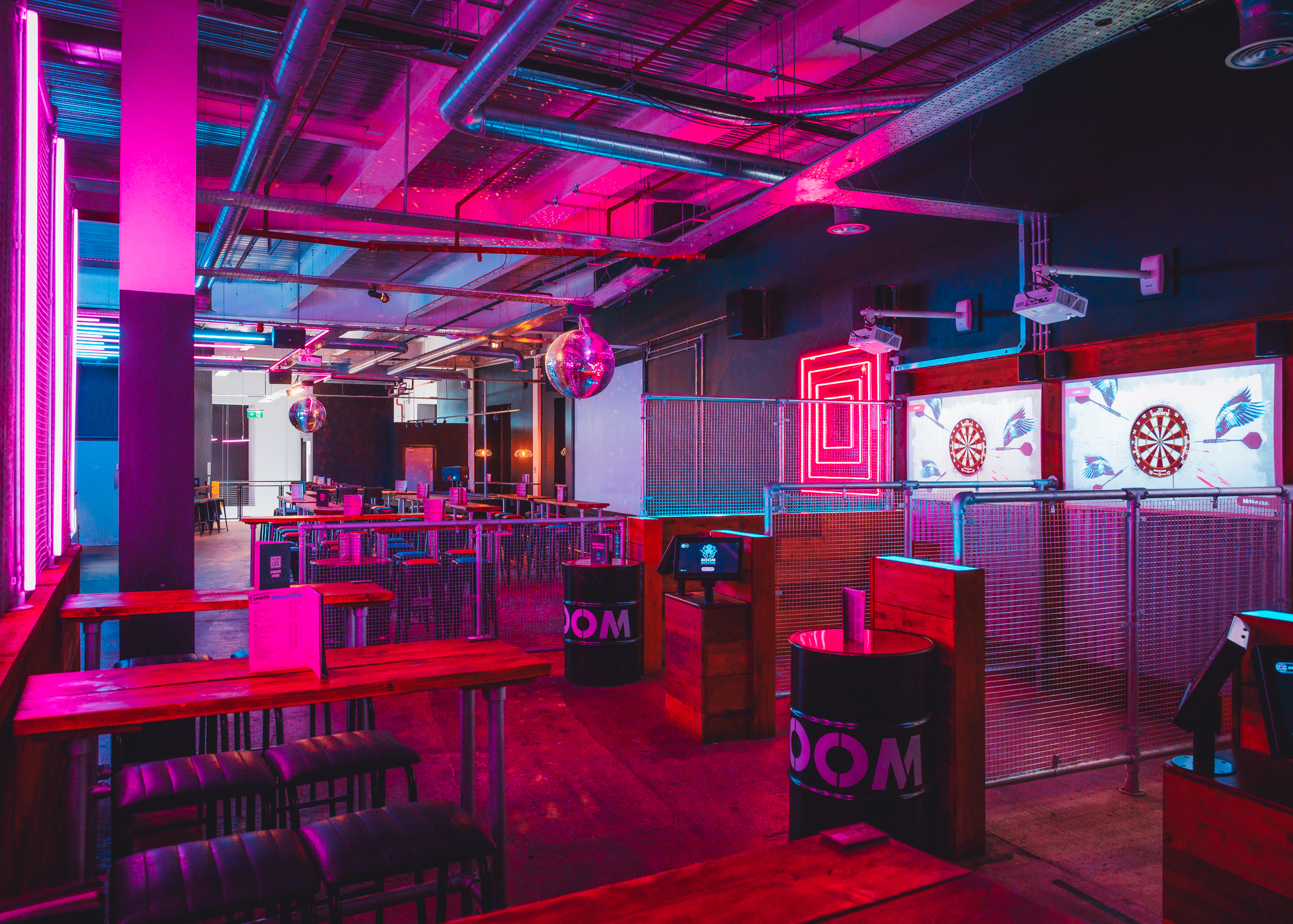 Vibrant event space with neon lights for networking and team-building in Leeds.