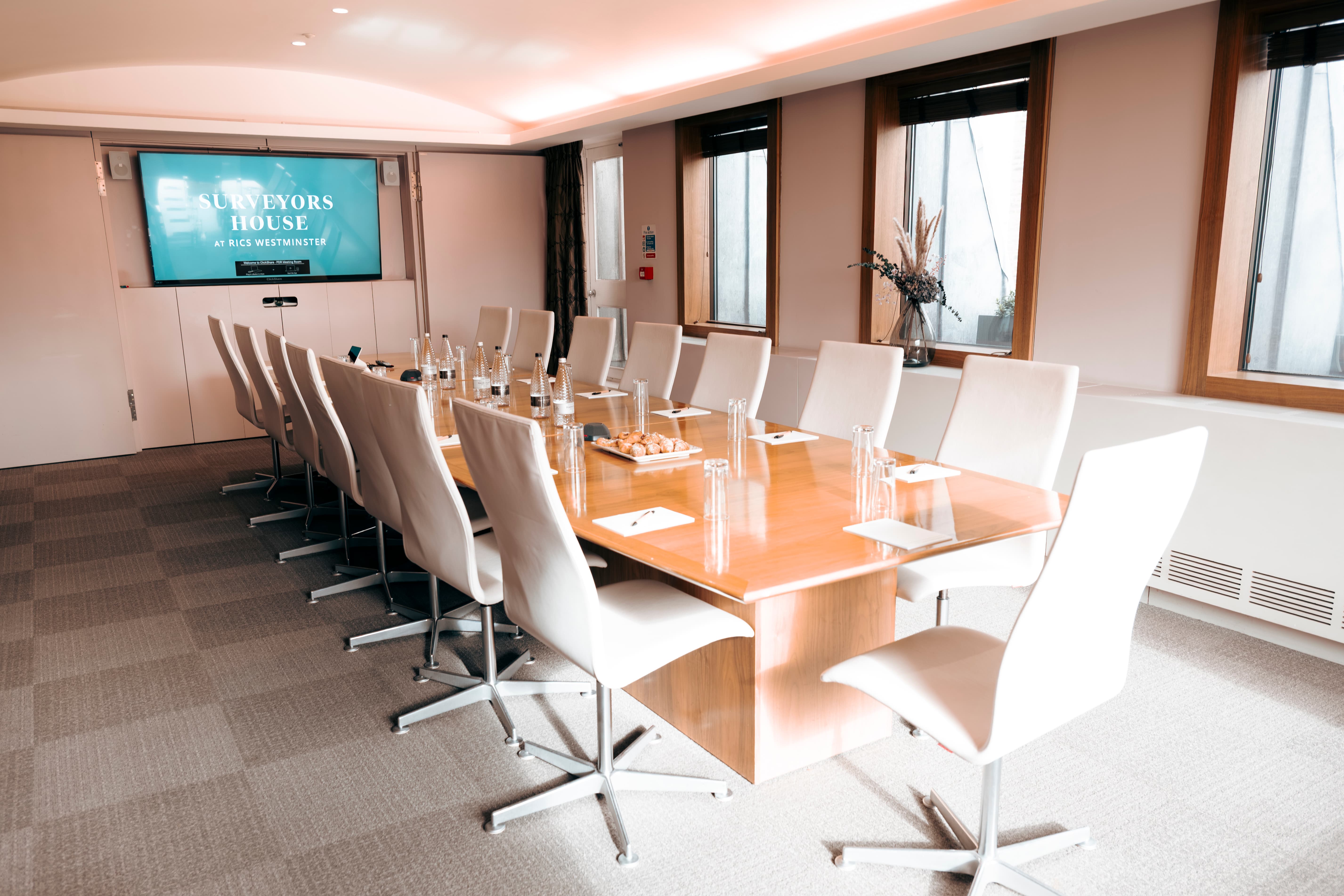 Boardroom-style President's Dining Room with A/V for professional executive meetings.