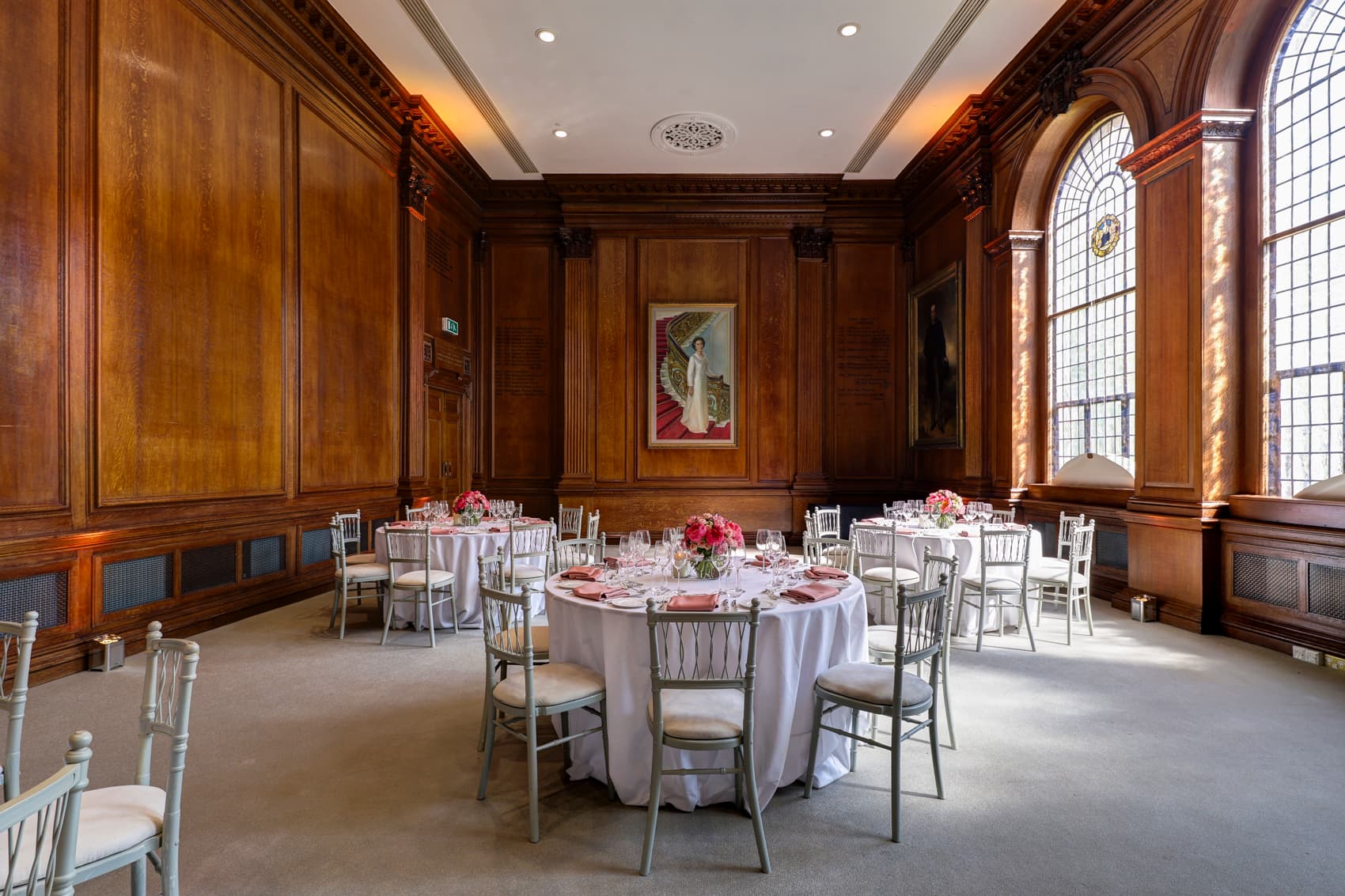 Elegant lecture hall with wooden paneling, perfect for weddings and corporate events.