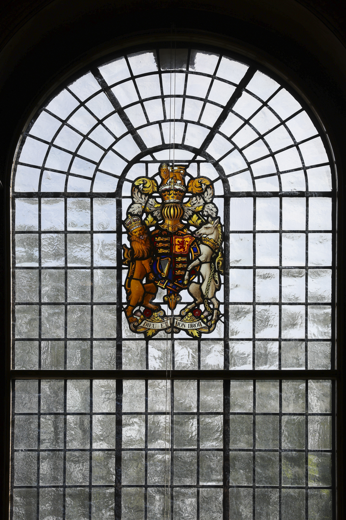 Stained glass window in Lecture Hall, perfect for formal events and gatherings.