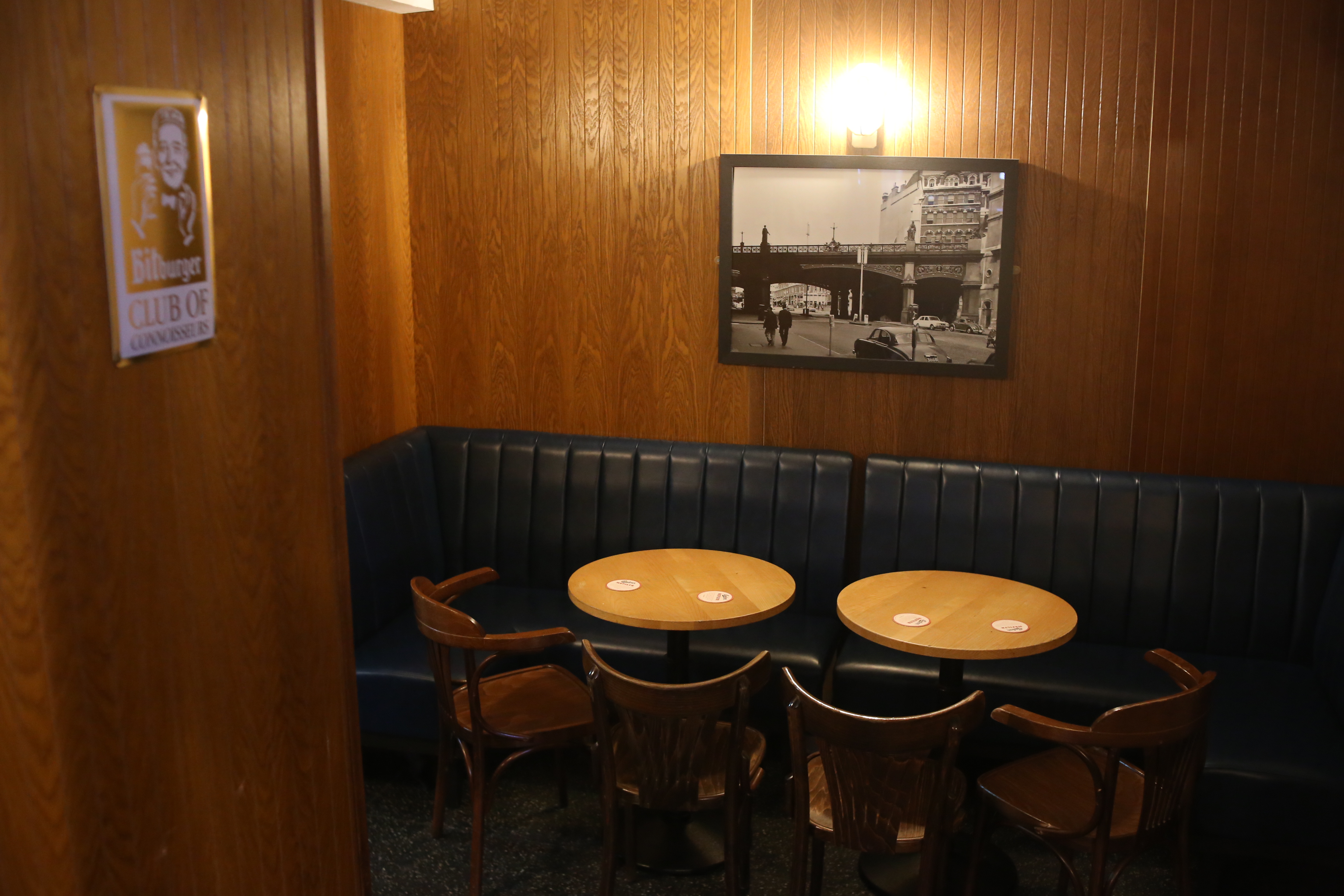 Cozy meeting space at Basement Hire, Farringdon Tap, featuring blue leather seating.