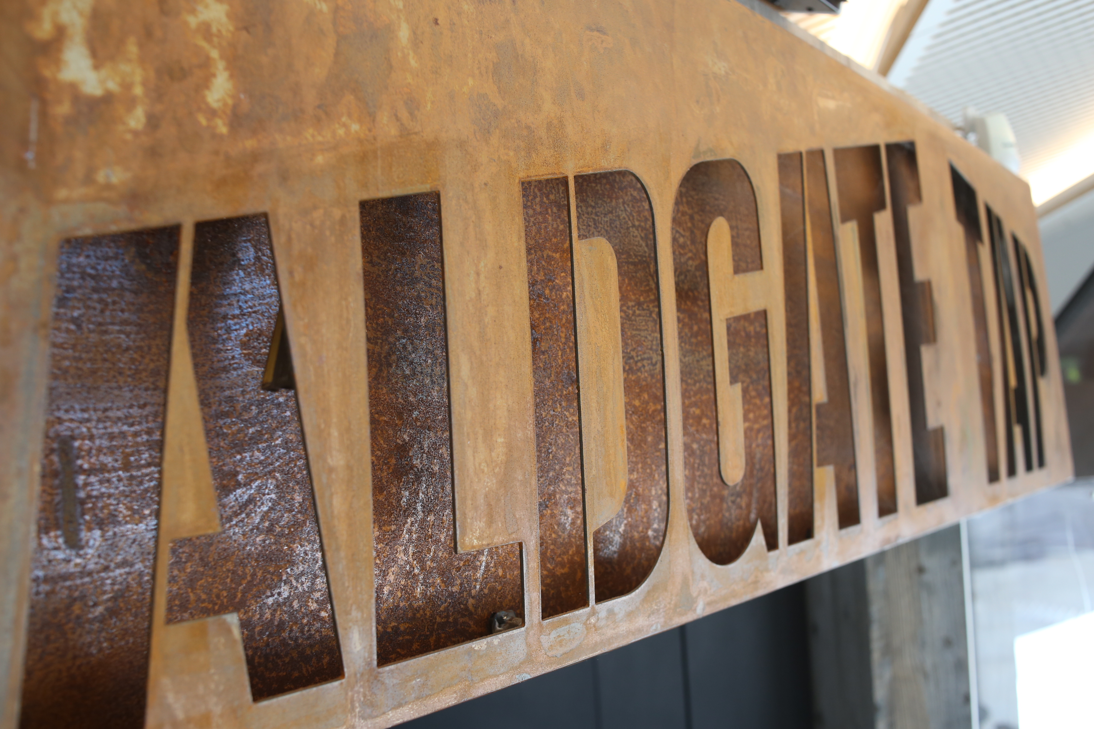 Aldgate Tap venue sign, rustic charm for informal gatherings and networking events.