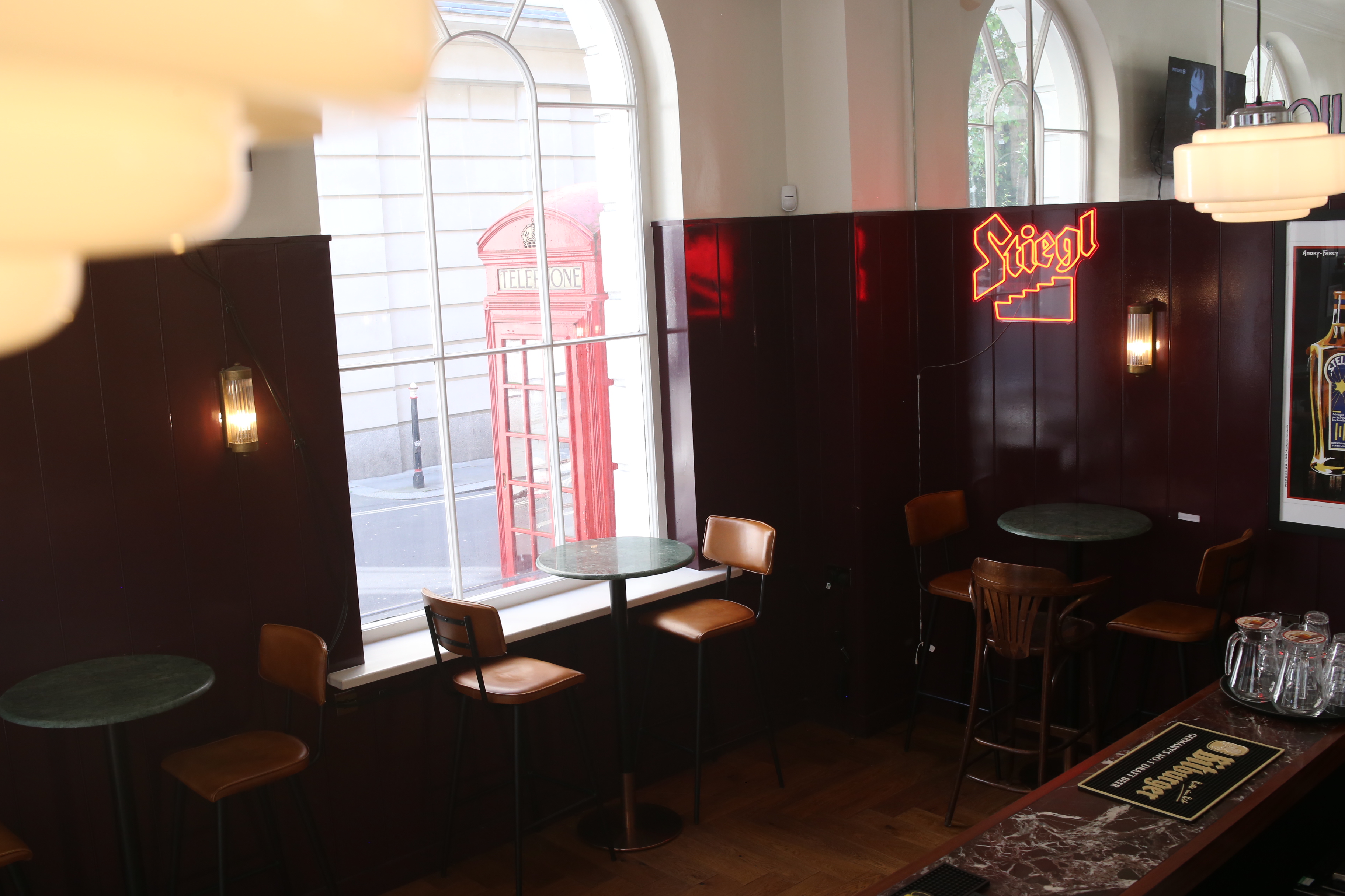 Charming bar area with wooden accents for cozy networking events at The Bolter.
