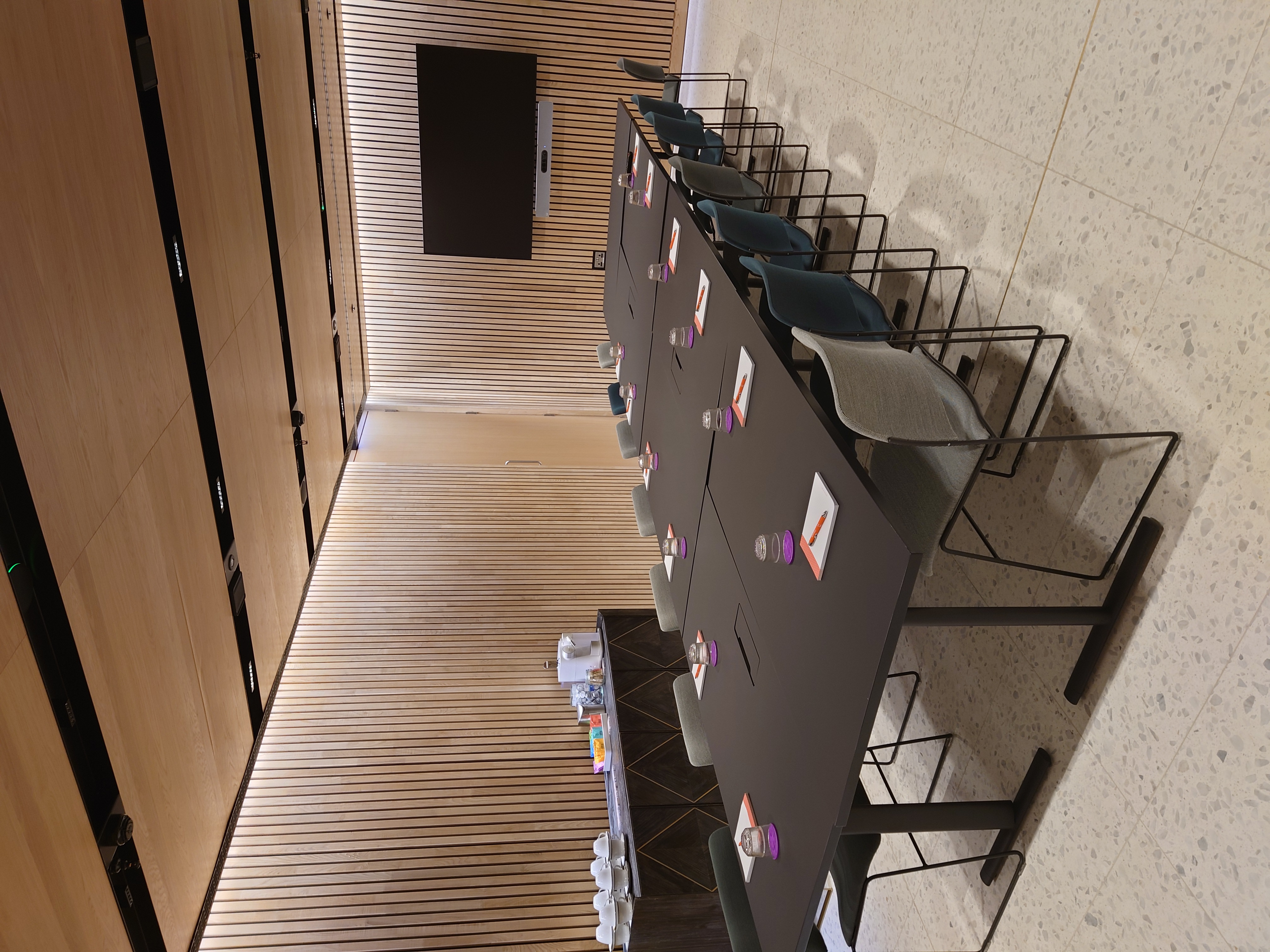 Modern meeting room at 8 Bishopsgate with black table, ideal for workshops and presentations.