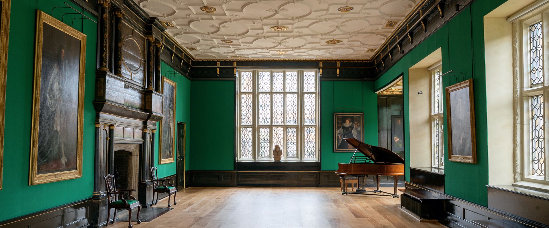 Great Chamber in The Charterhouse, elegant event space with grand piano for receptions.