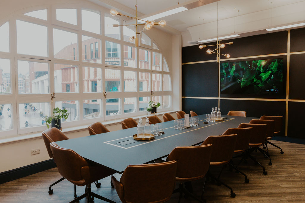 Modern conference room in Wizu Workspace, featuring a sleek table and natural light.