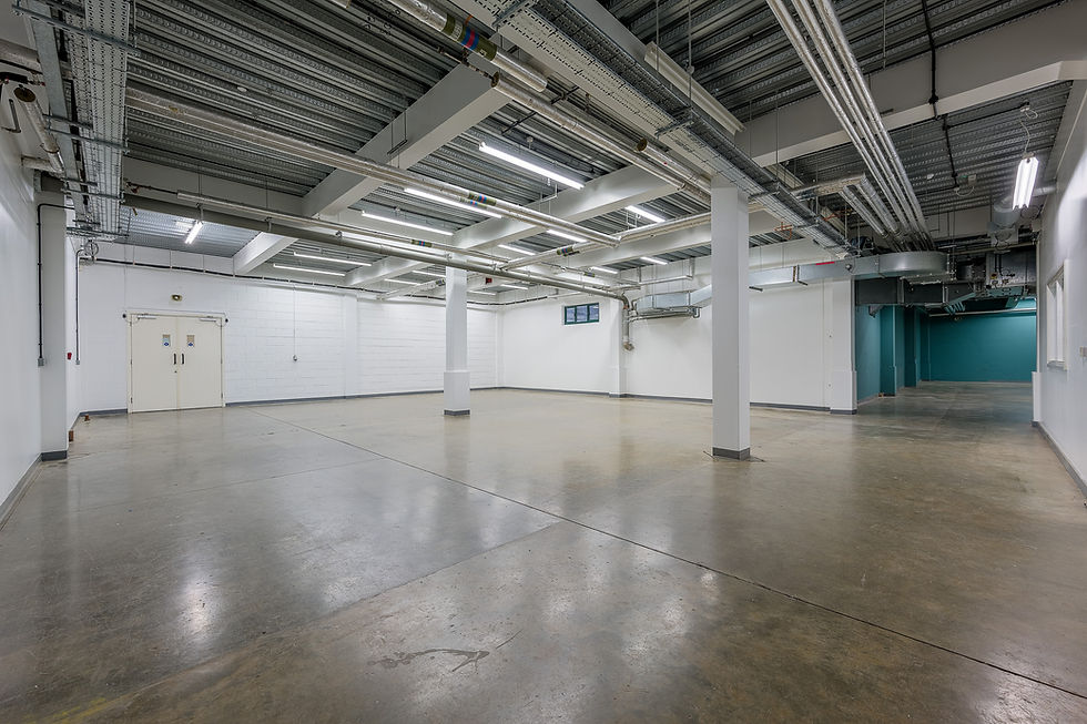 Versatile open event space in London with minimalist design for corporate meetings and gatherings.