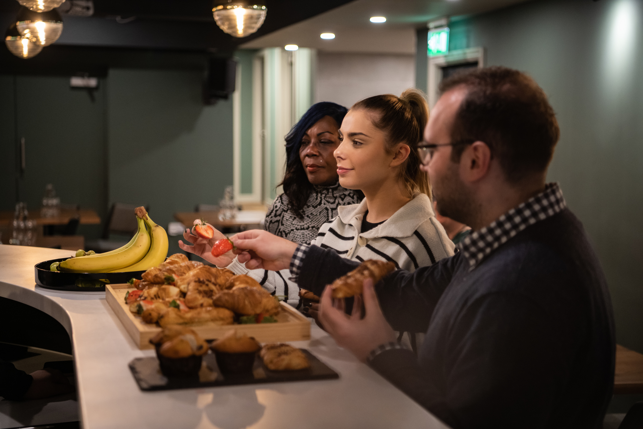 Park Place Event Space refreshment station with pastries and fruit for networking events.