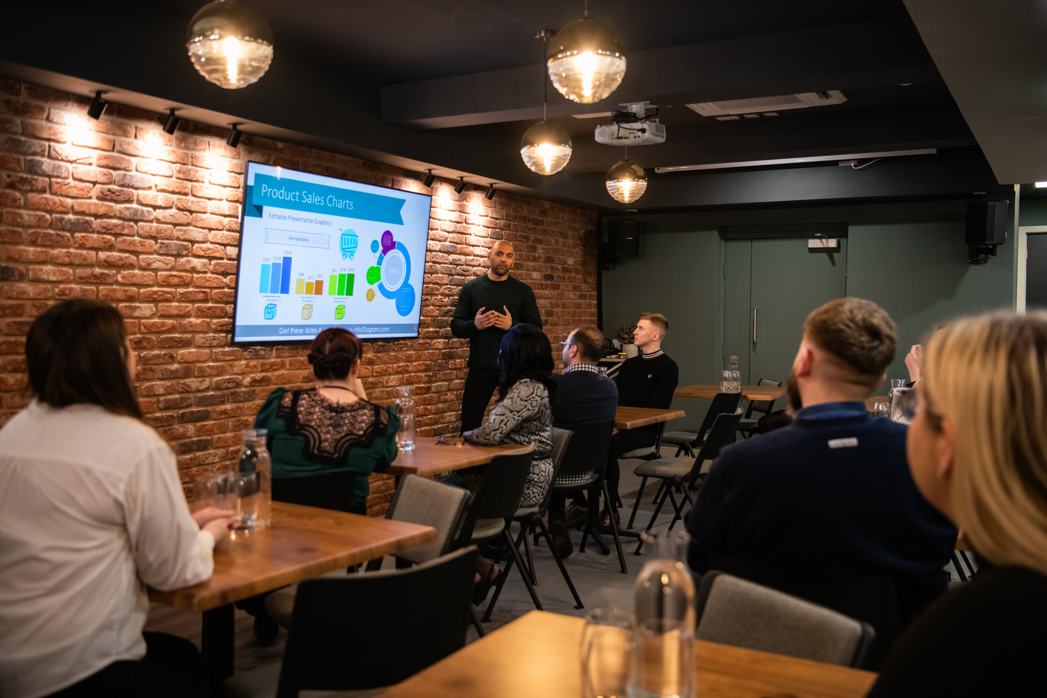 Intimate meeting space at Park Place Event Space with brick wall, ideal for workshops.